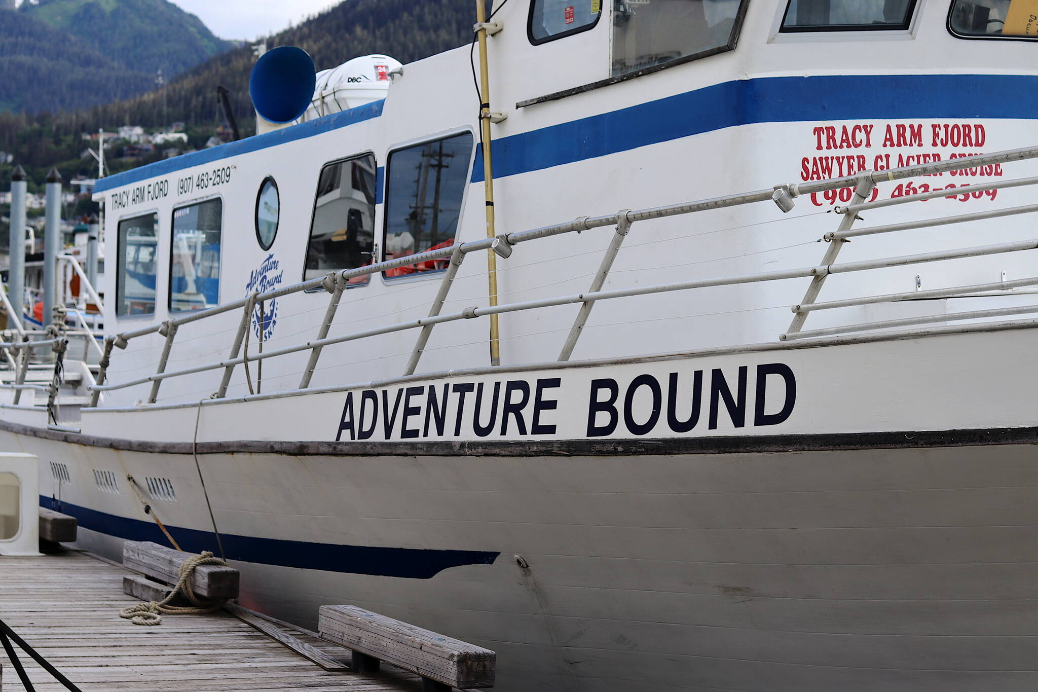 The Adventure Bound tour boat is seen here docked at Aurora Harbor during the past week. The vessel’s owner-operator was given four notices of deficiencies last year, but continued to operate, according to a U.S. Coast Guard report that also raises questions about the agency’s handling of a grounding incident involving the company. (Meredith Jordan / Juneau Empire)