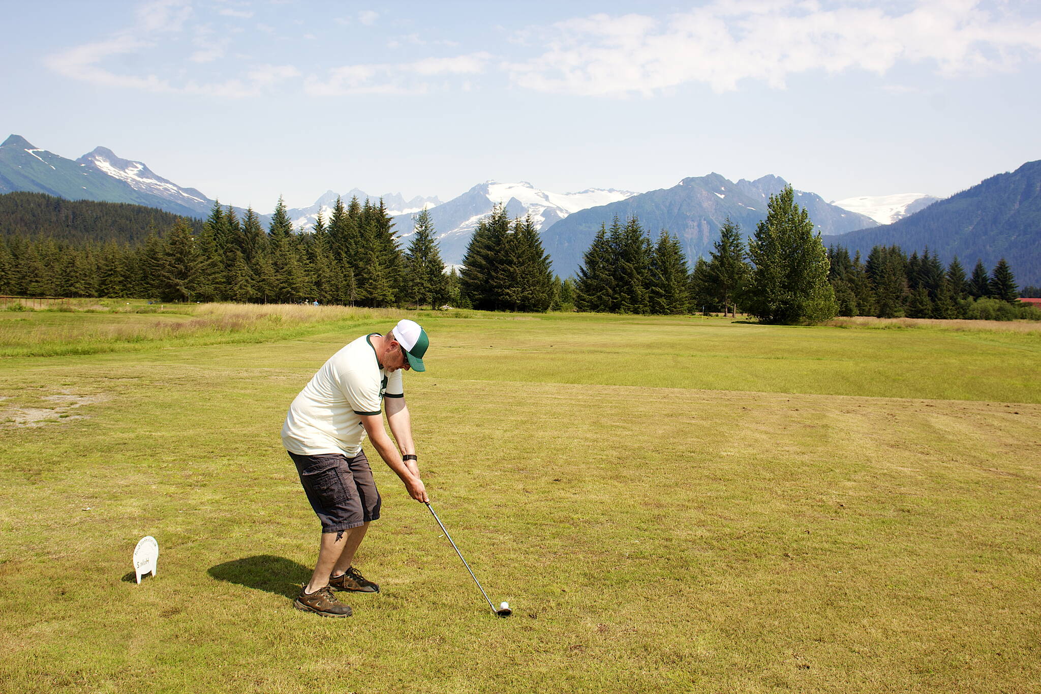 Karter Koelsch prepares to tee off at the second hole at the Annual Greater Juneau Chamber of Commerce Golf Classic on Saturday at the Mendenhall Golf Course. (Mark Sabbatini / Juneau Empire)