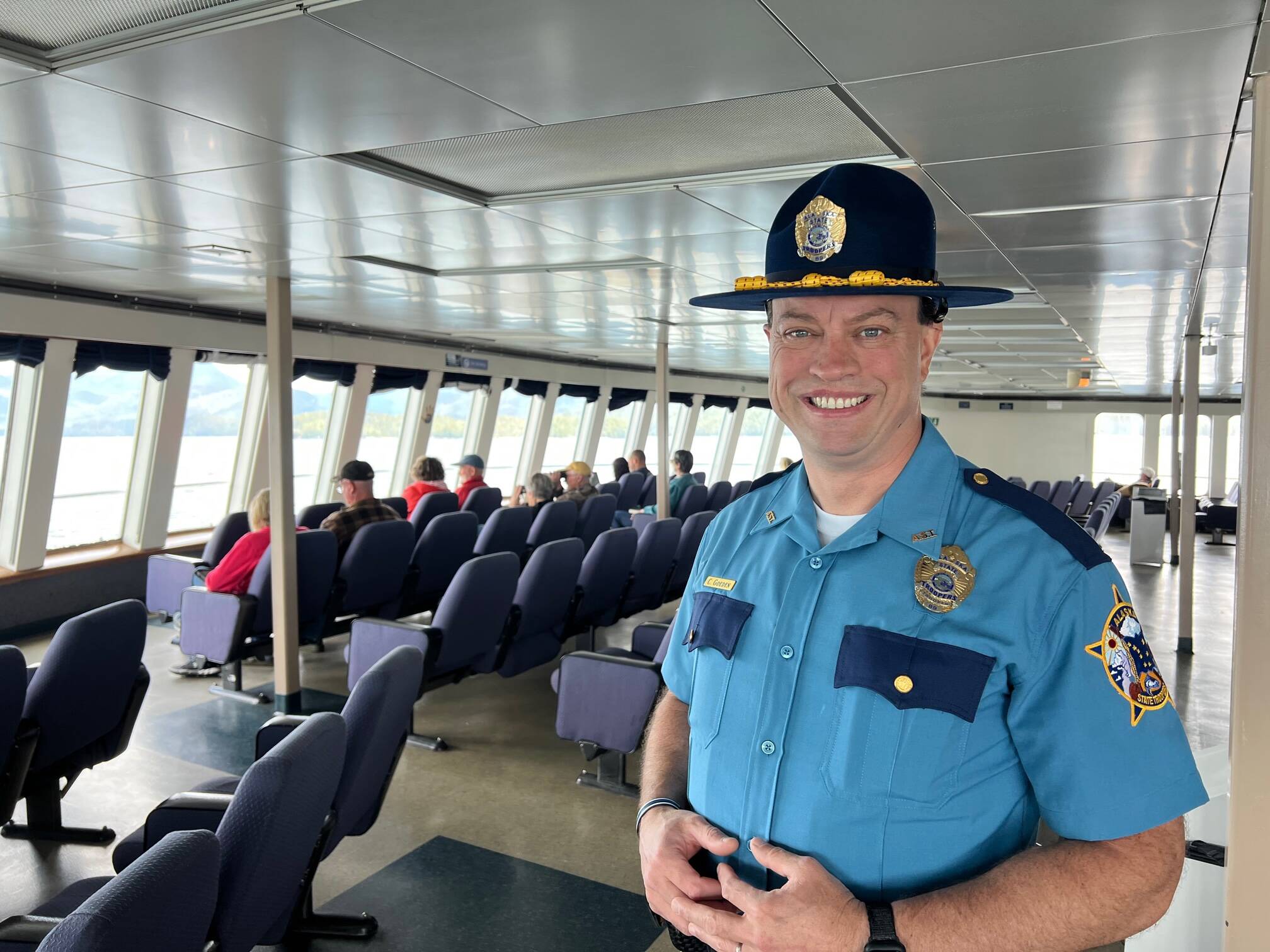 Chad Goeden, seen here on board the Columbia in mid-July, is one of two retired Alaska State Troopers participating in a new program that serves as deterrent while also strengthening security on the Alaska Marine Highway System. (Meredith Jordan / Juneau Empire)