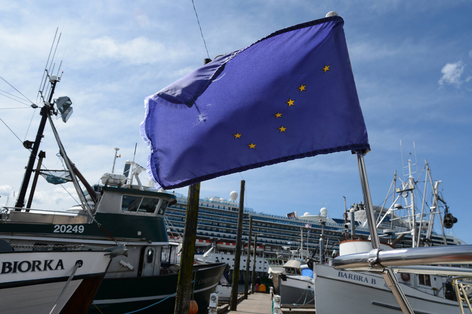 The Alaska flag flies from the bow of a boat in one of Ketchikans small-boat harbors on July 24. (Photo by James Brooks/Alaska Beacon)