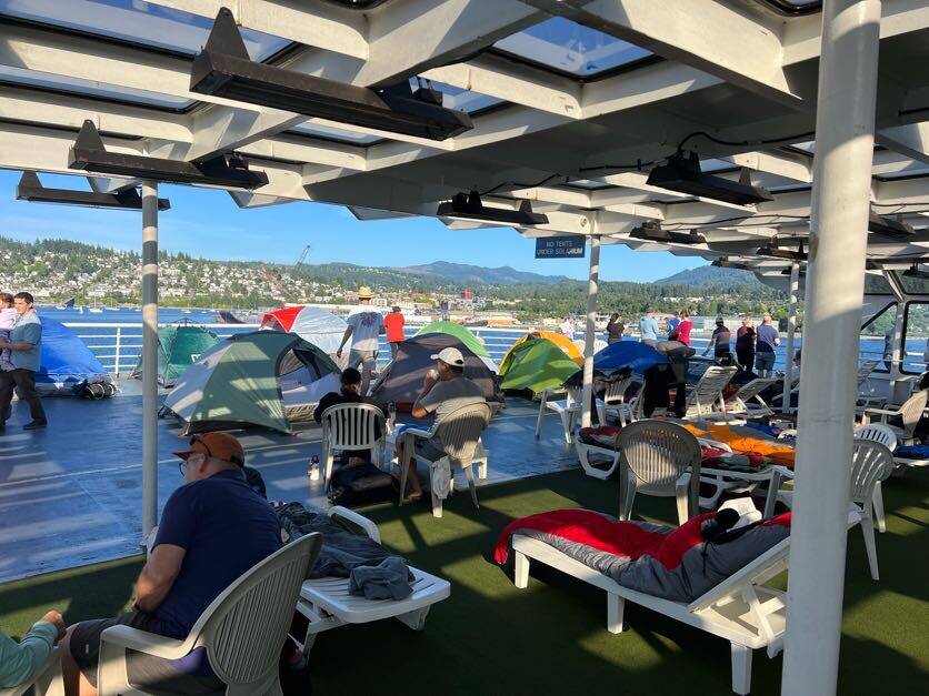 Tents fill a passenger deck of the Columbia as it departs Bellingham, Washington, on July 14. Such “campouts” are part of the most notorious aspects of the nearly 50-year-old Alaska Marine Highway System vessel. (Meredith Jordan / Juneau Empire)