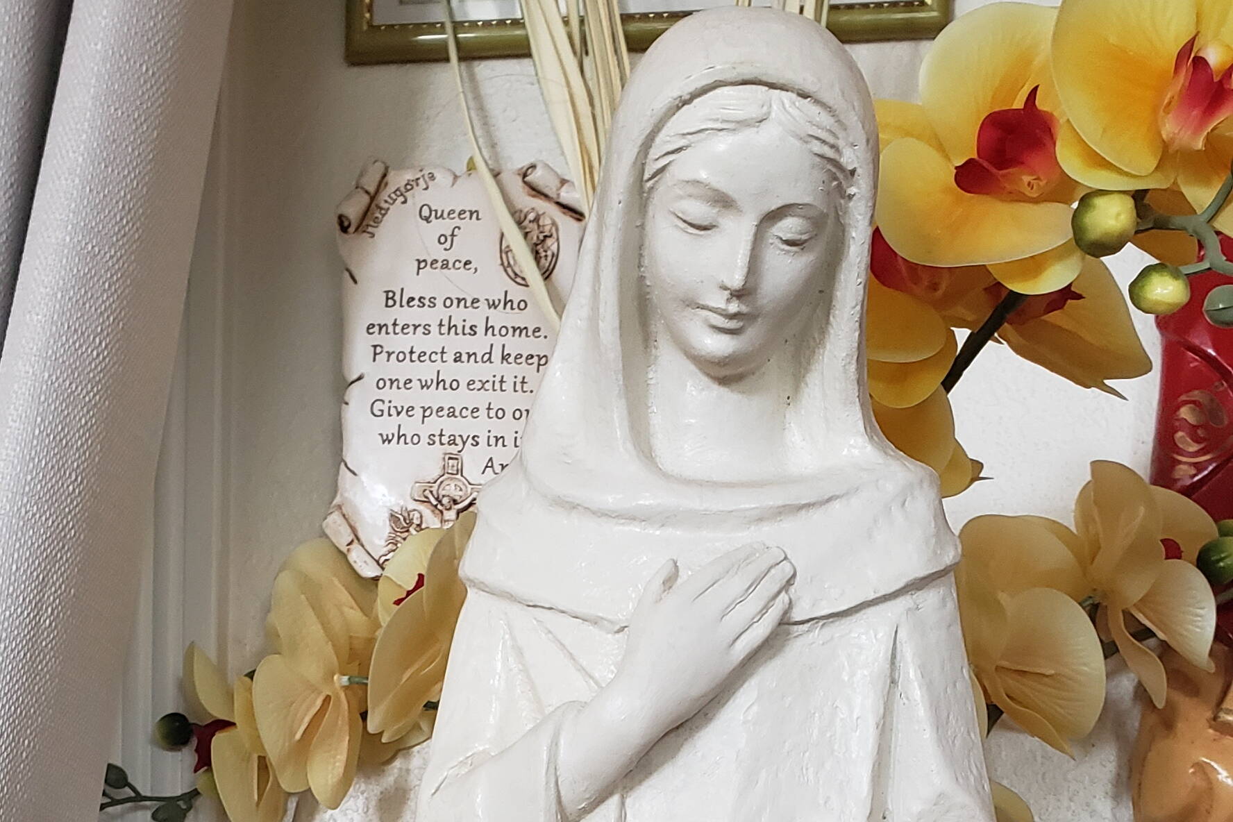 A statue of the Most Holy Mother Mary at the author’s home alter in Juneau. (Photo by Gina Del Rosario)