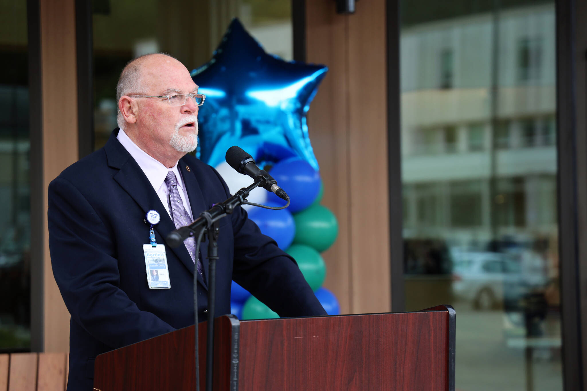 Hospital CEO David Keith speaks to residents and hospital officials who gathered at Bartlett Regional Hospital’s new behavioral health and crisis stabilization center unveiling in June. On Tuesday hospital officials announced his resignation after less than a year in the position. (Clarise Larson / Juneau Empire File)