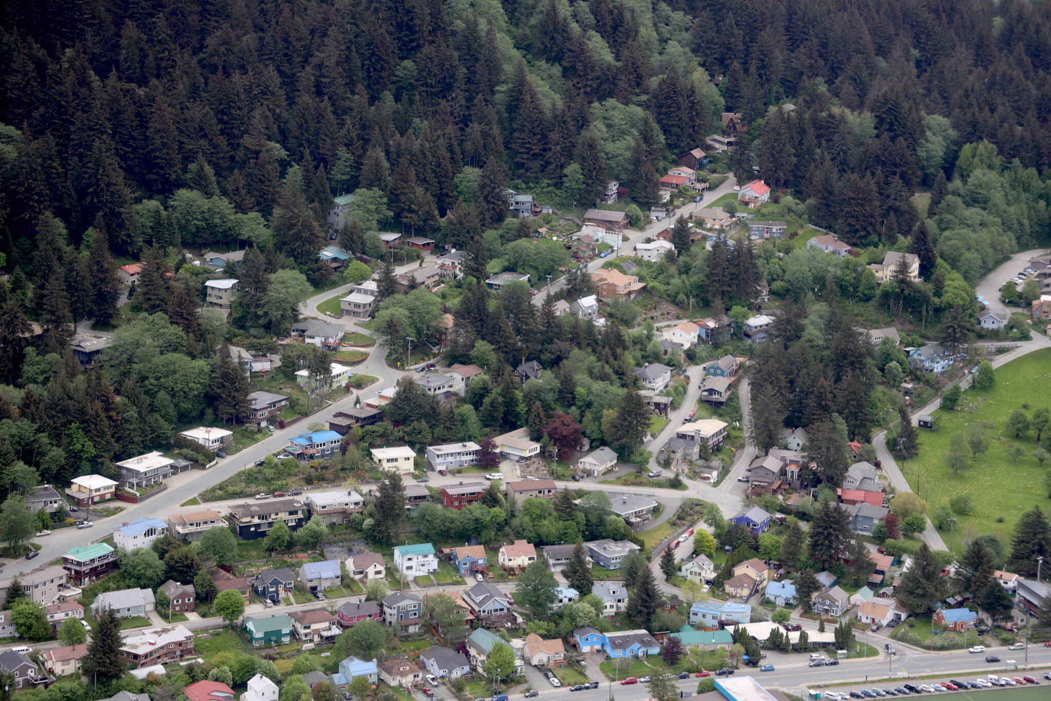 Rows of houses line roads near Juneau-Douglas High School: Yadaa.at Kalé in late May. (Clarise Larson / Juneau Empire File)
