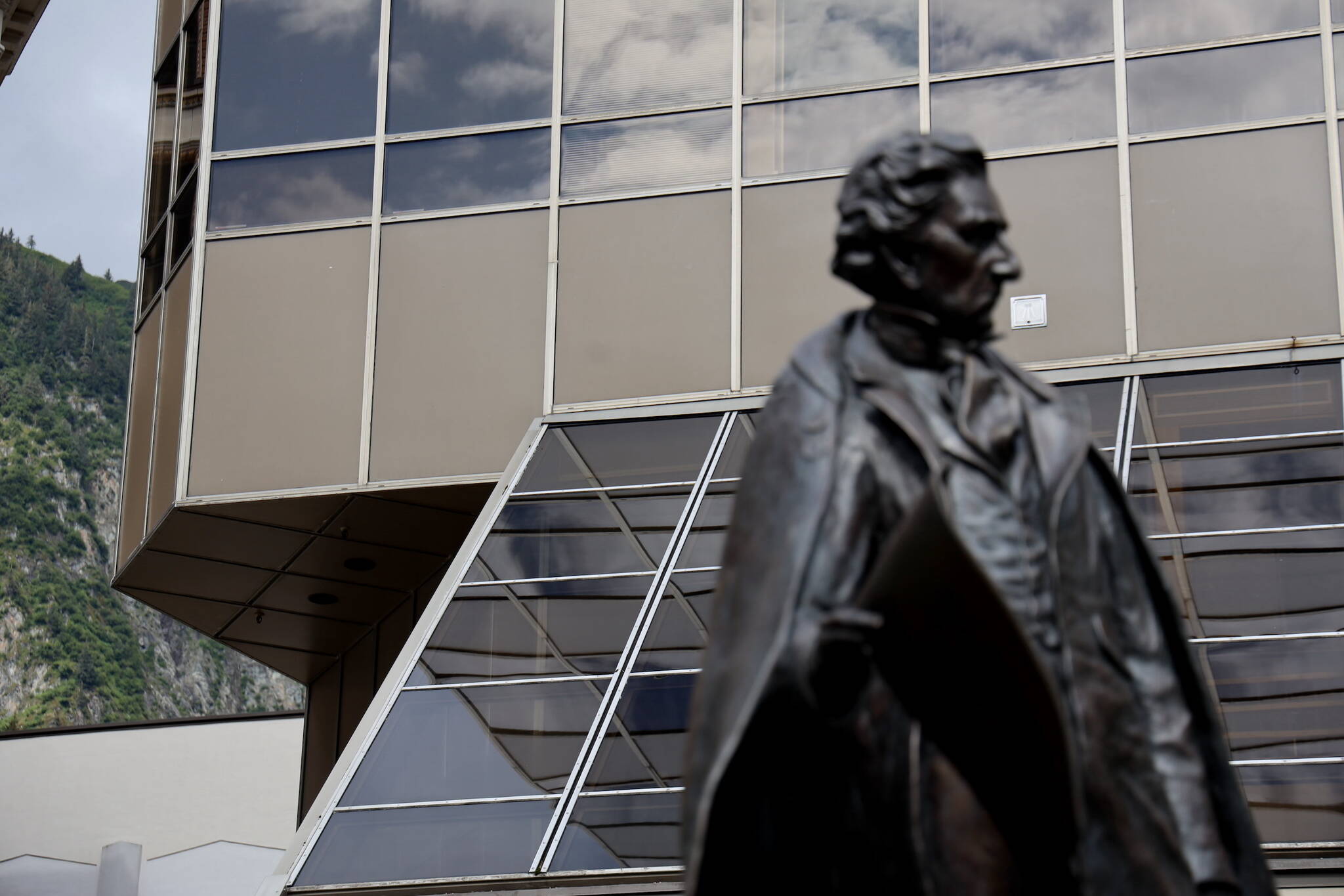 A statue of William Henry Seward stands outside the Dimond Courthouse in downtown Juneau. The family of a Juneau man who died after suffering a blunt-force neck injury filed a wrongful death lawsuit against Carver Construction LLC, arguing it breached its duty to ensure the family’s residence was reasonably safe amid ongoing renovations. (Clarise Larson / Juneau Empire File)