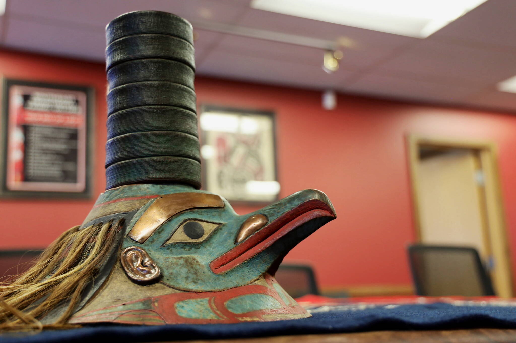 This photo taken in Juneau on Monday is of the Ghaanka Yéil S’áaxhw (Raven of the Roof, Hat) from the L’uknaxh.ádi clan in Sitka. The item from repatriated from the University of Pennsylvania. (Clarise Larson / Juneau Empire)