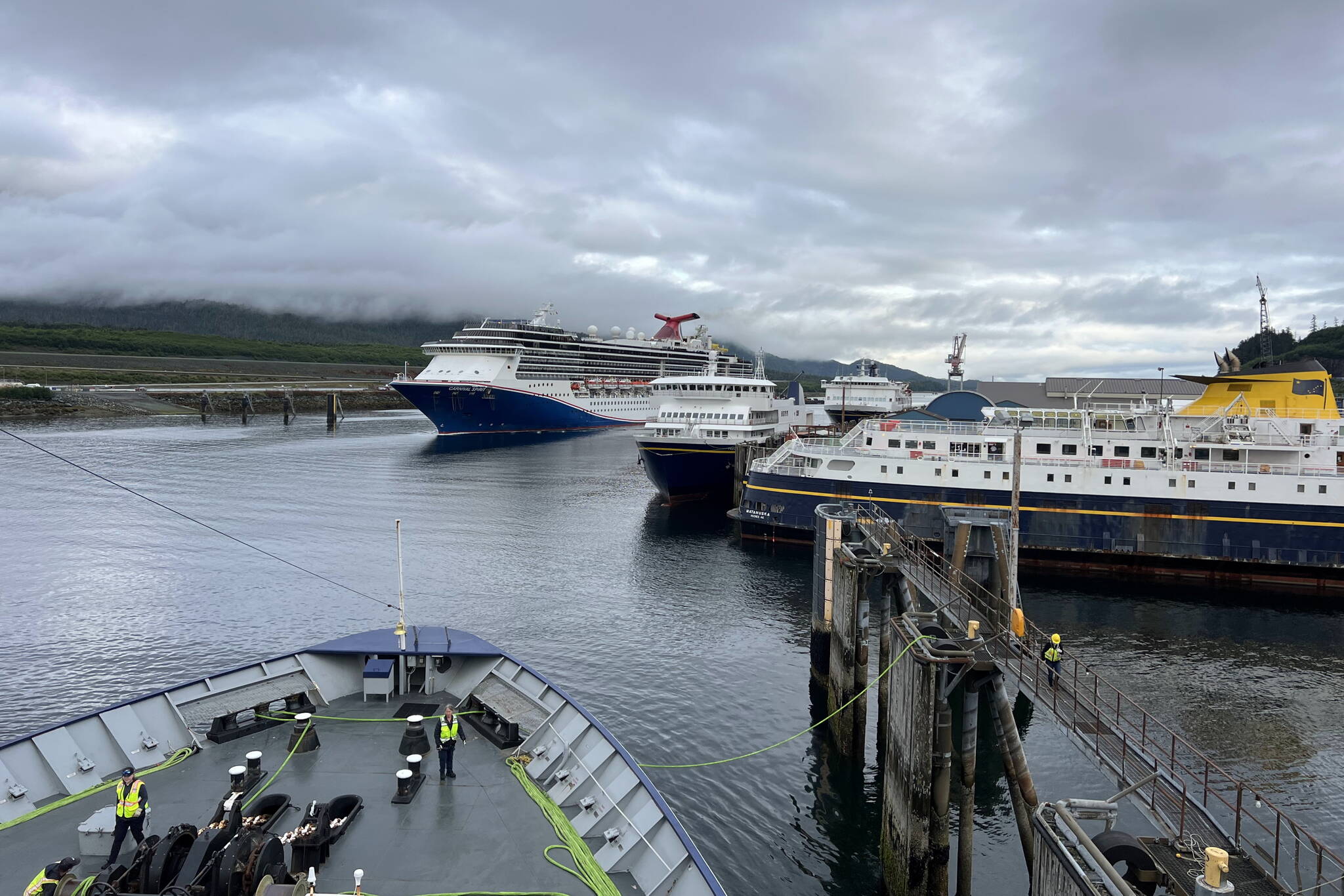 Three Alaska Marine Highway System ferries are docked at its headquarters in Ketchikan as the Columbia arrives on July 16. (Meredith Jordan / Juneau Empire)