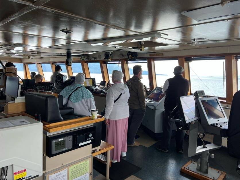 Passengers visit the bridge of the Columbia ferry during a stop in mid-July. (Meredith Jordan / Juneau Empire)
