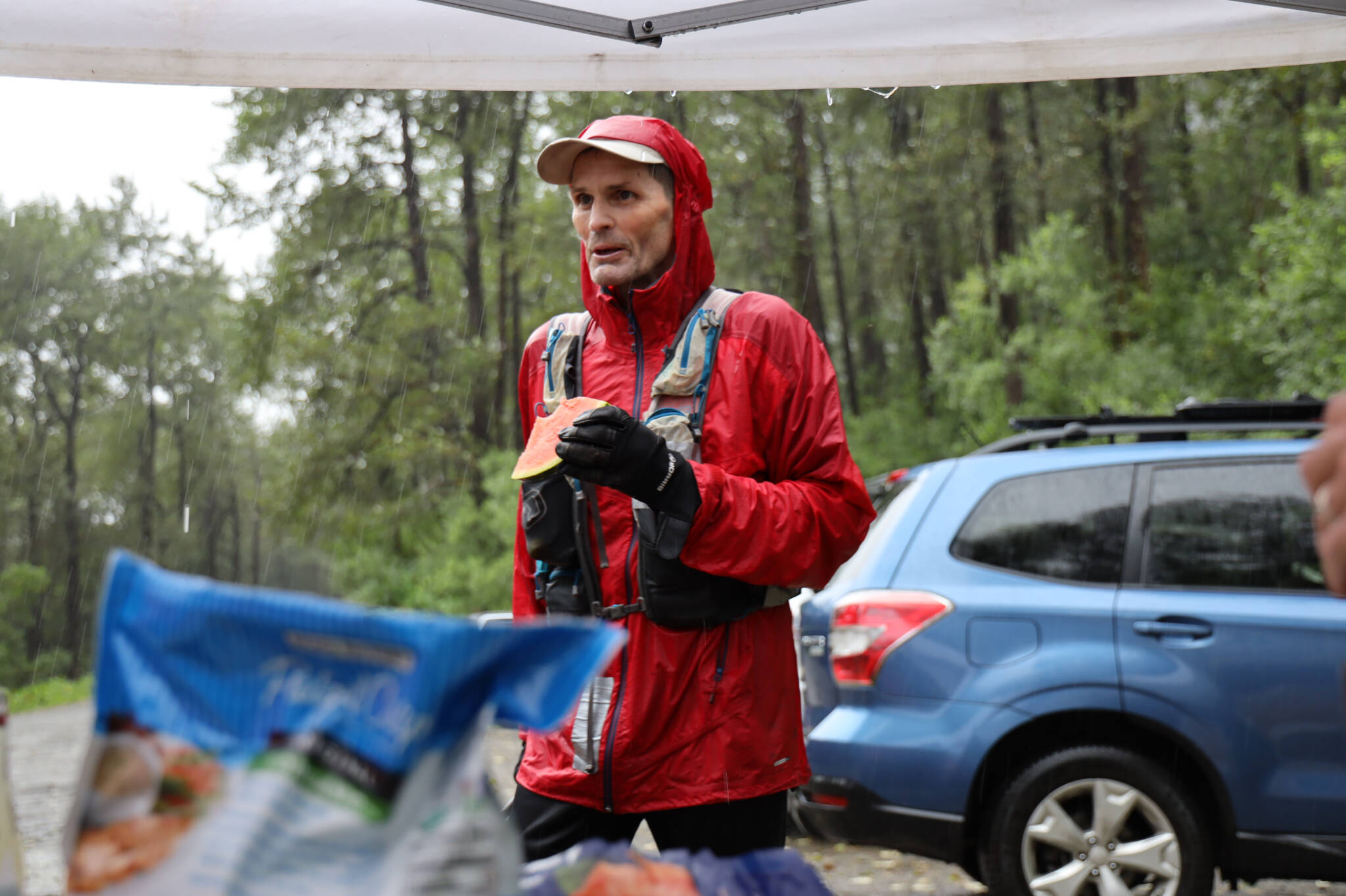 Klas Stolpe stops at an aid station to refuel before starting the next leg of the Nifty Fifty 50K race Saturday afternoon. Stolpe was the second male finisher of the race with a time of five hours, 49 minutes and 58 seconds.