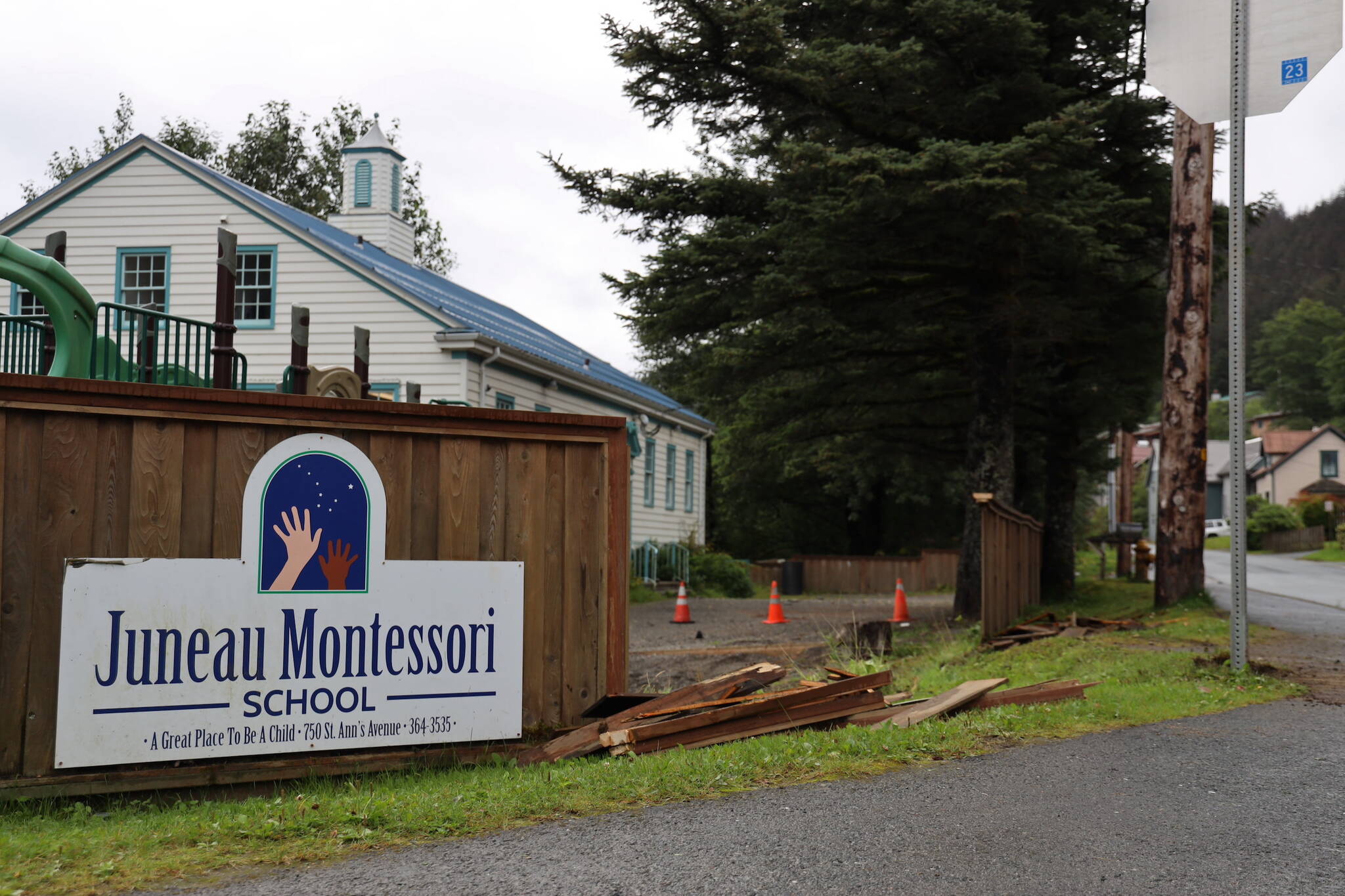 A portion of fence at Juneau Montessori School is missing following a hit-and-run crash early Thursday morning. (Clarise Larson / Juneau Empire)