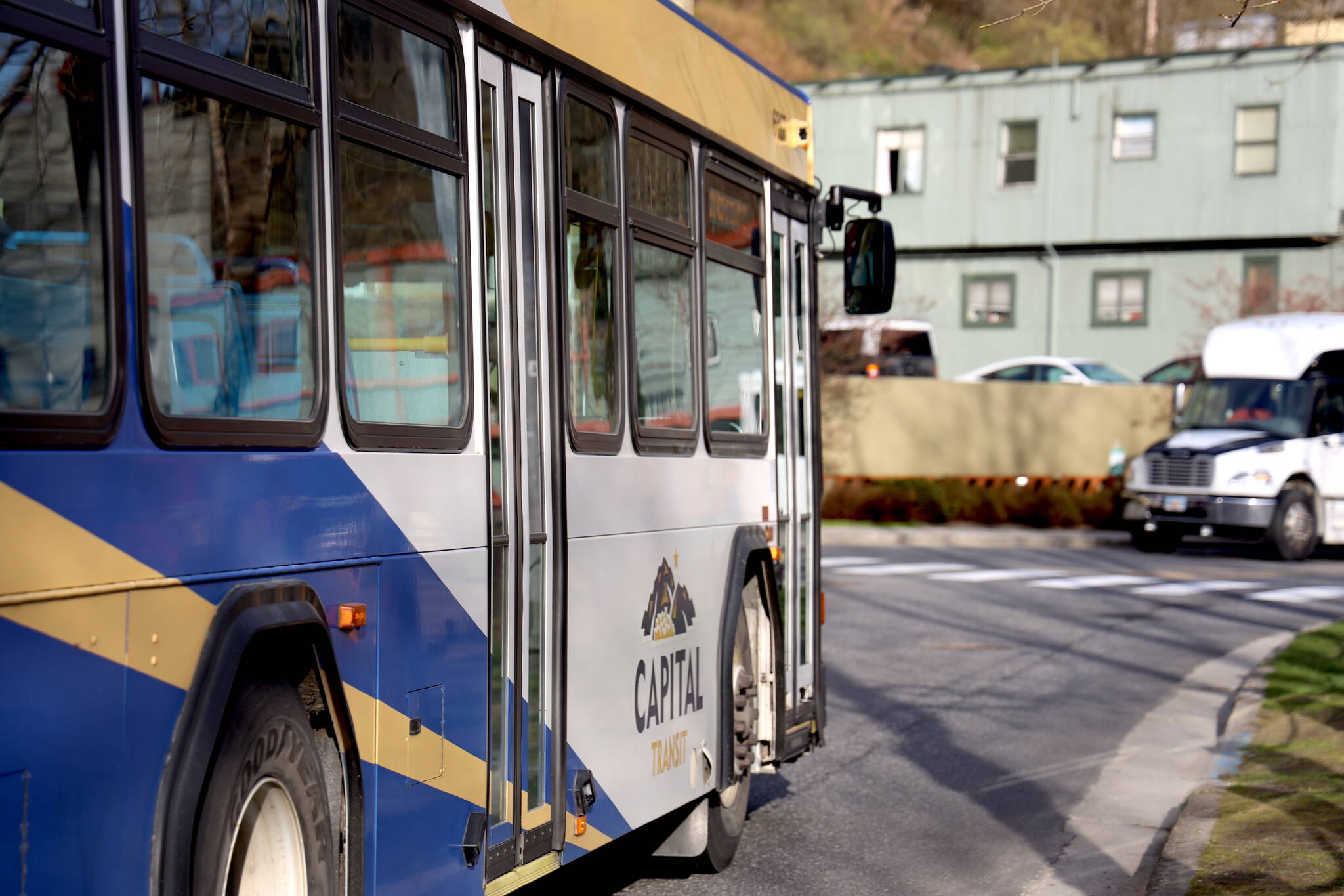 A Capital Transit bus makes its way downtown in August. The City and Borough of Juneau is considering a public transit bus to use as a winter warming shelter as it has received no bids to host a shelter. (Clarise Larson / Juneau Empire)