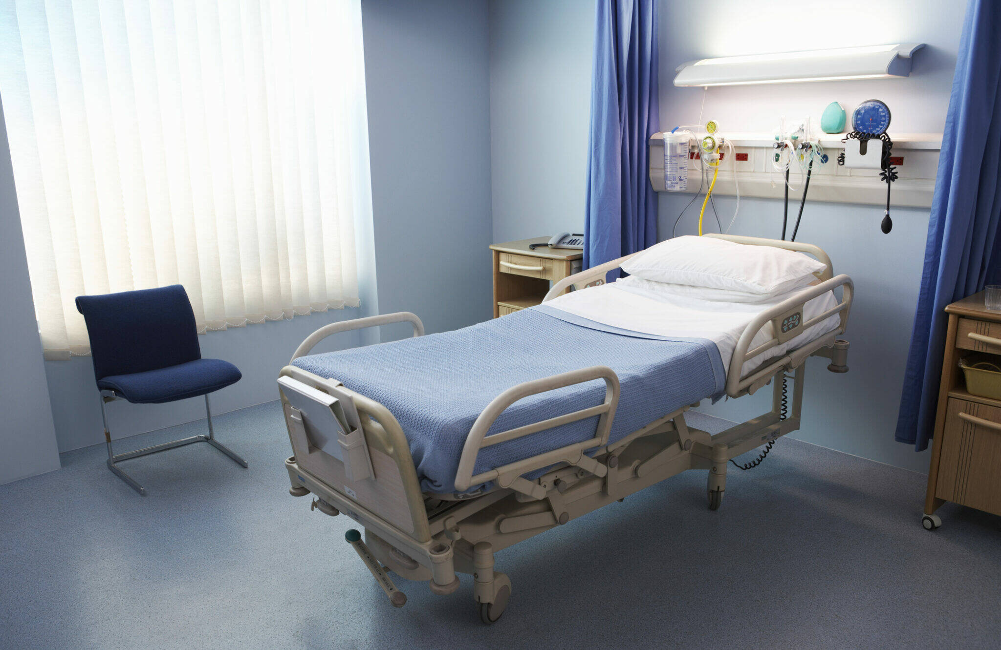 An empty hospital bed in a ward. (Photo by Flying Colours Ltd/Getty Images)