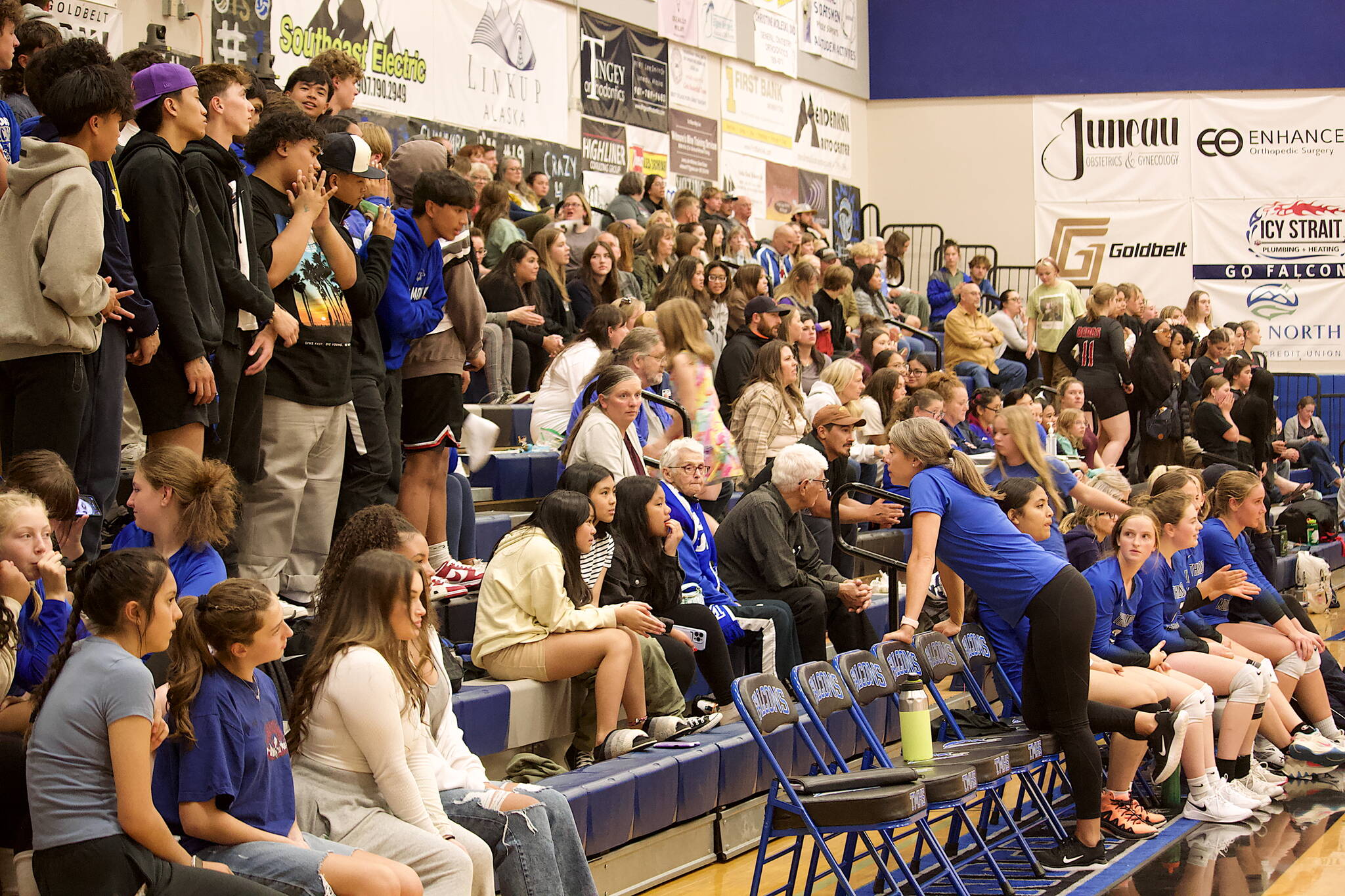 A largely “home” crowd fills the bleachers at Thunder Mountain High School on Friday night for the volleyball team’s three-game matchup against Juneau-Douglas High School: Yadaa.at Kalé. (Mark Sabbatini / Juneau Empire)
