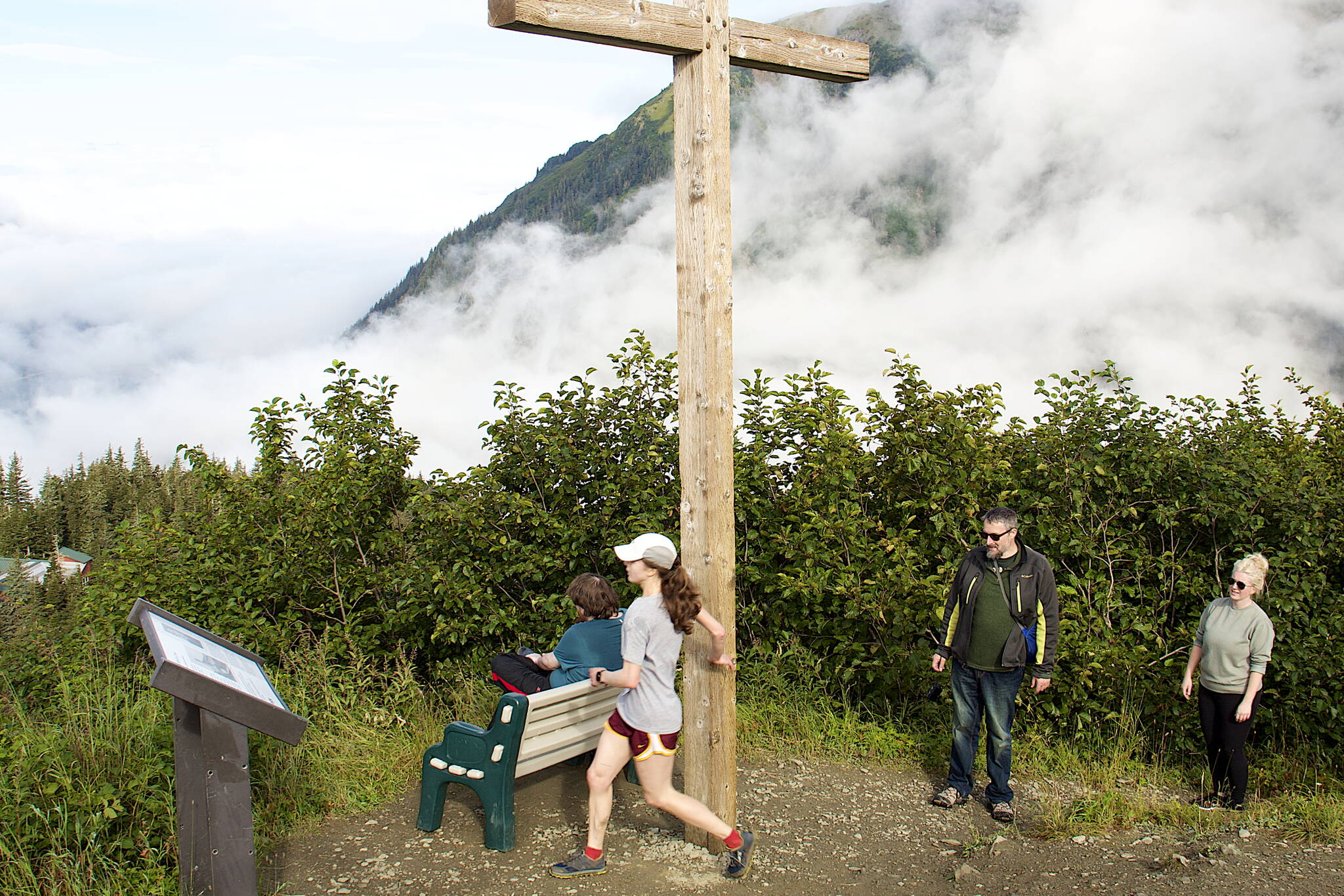 Robin Welling touches the Father Brown Cross to complete the Goldbelt Tram-Mount Roberts Run on Saturday. She was the fastest woman racer and third overall with a time of exactly 42 minutes. (Mark Sabbatini / Juneau Empire)
