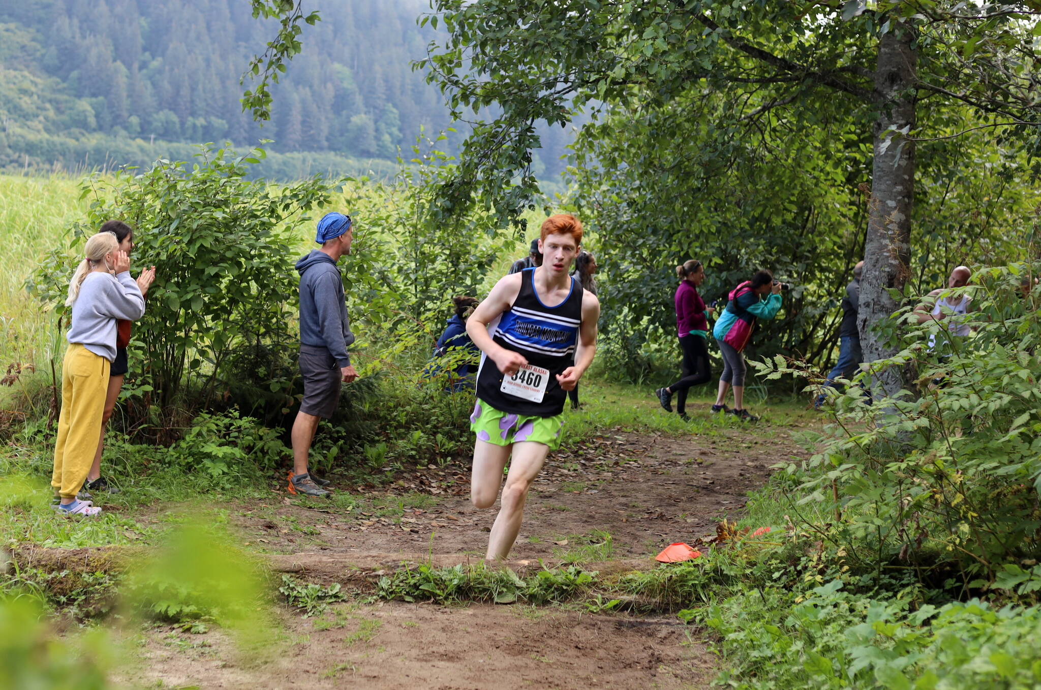 Thunder Mountain High School freshman racer Erik Thompson runs solo up a hill during the Sayeik Invitational on Douglas Saturday morning. Thompson finished the race third with a time of 17 minutes and 20 seconds. (Clarise Larson / Juneau Empire)