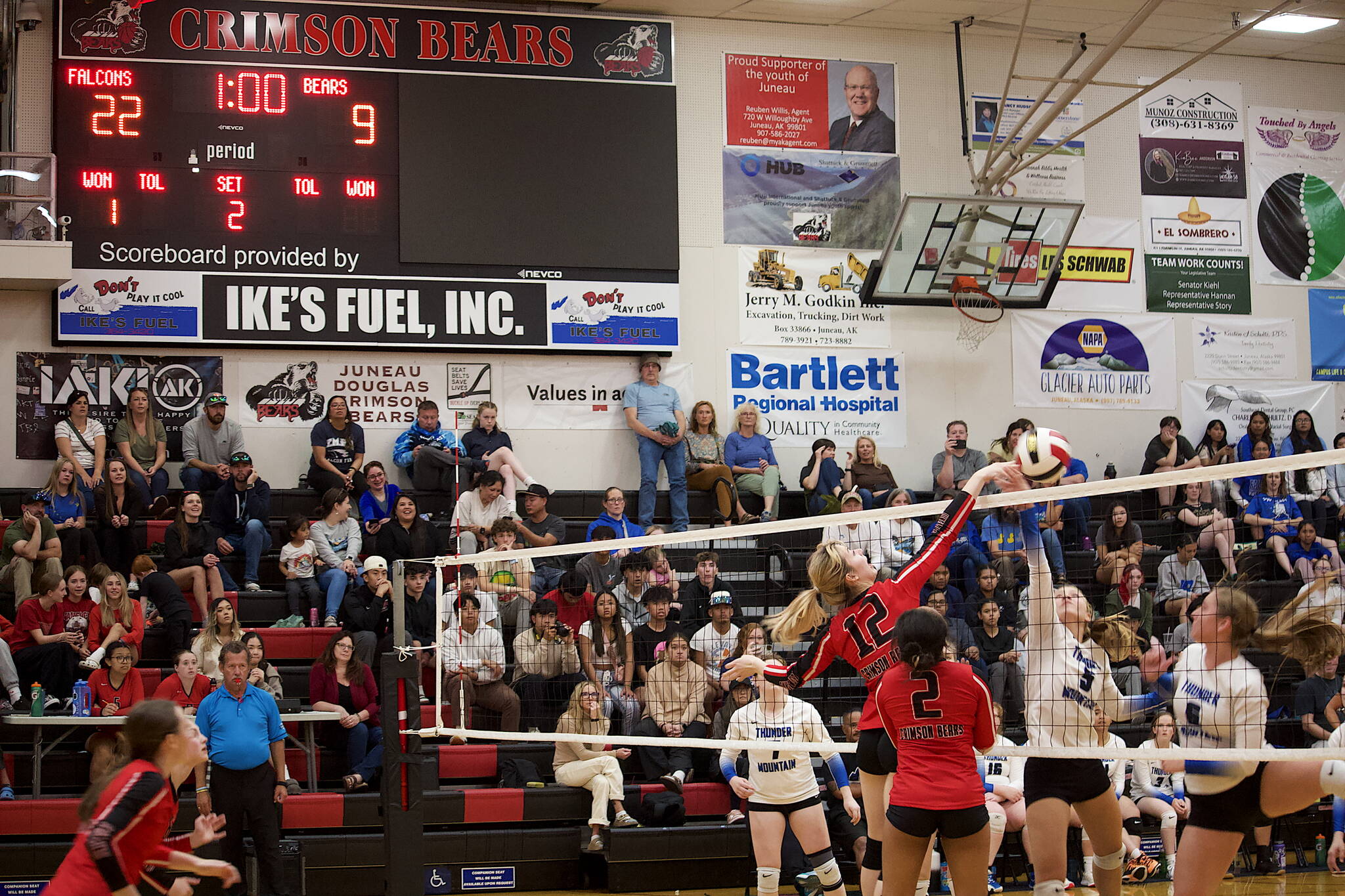 Evelyn Richards (12) spikes the ball to score a point Juneau-Douglas High School: Yadaa.at Kalé near the end of the team’s second game against Thunder Mountain High School on Saturday at JDHS. THMS won the game by a score of 25-10. (Mark Sabbatini / Juneau Empire)