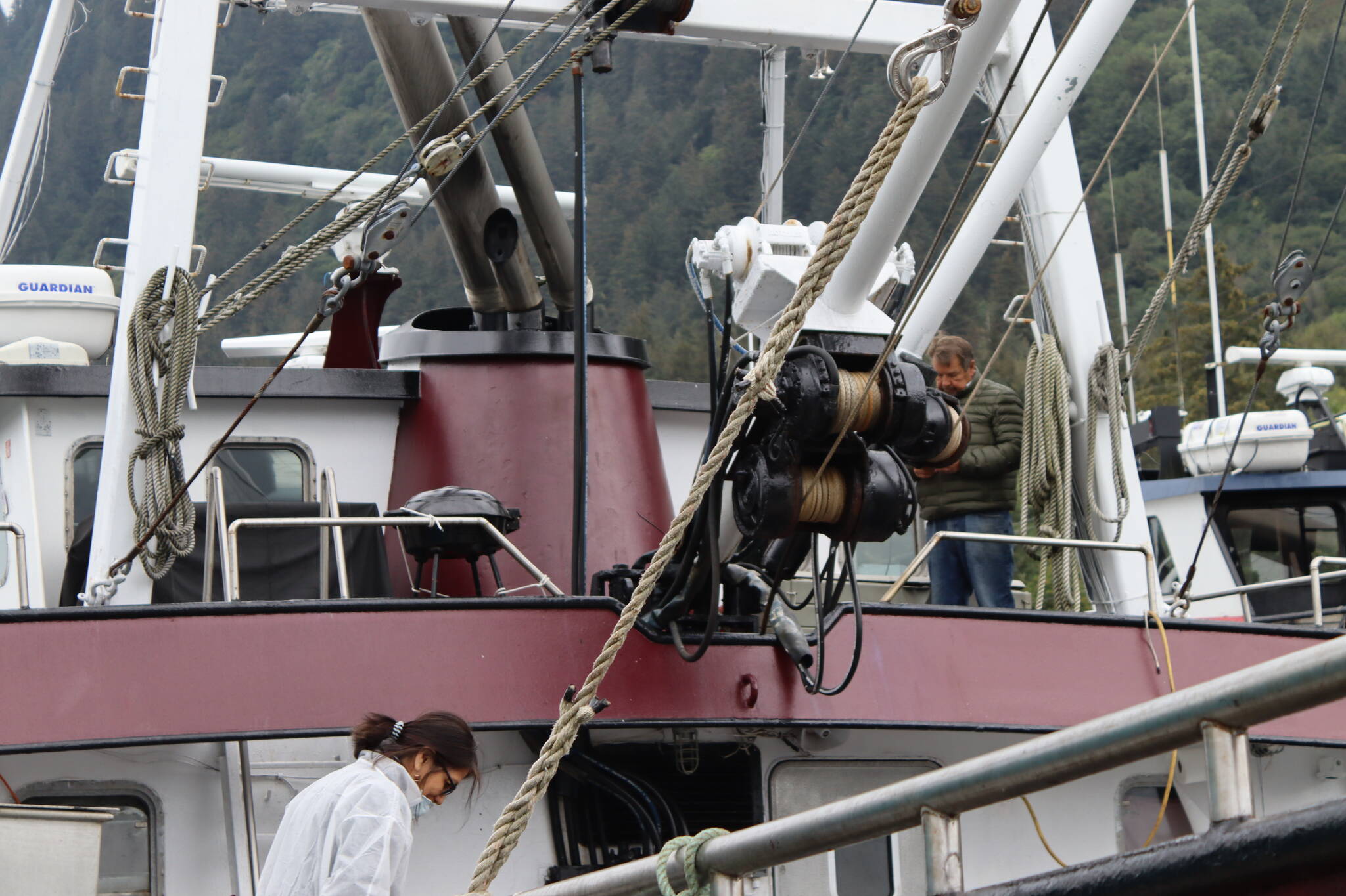 Norval Nelson, owner and operator of Star of the Sea, and his wife, Barbara Cadiente, clean and prep the boat in Aurora Harbor on Wednesday, the same day the Alaska Department of Fish and Game announced commercial crab fisheries would remain closed again this year. (Meredith Jordan/Juneau Empire)