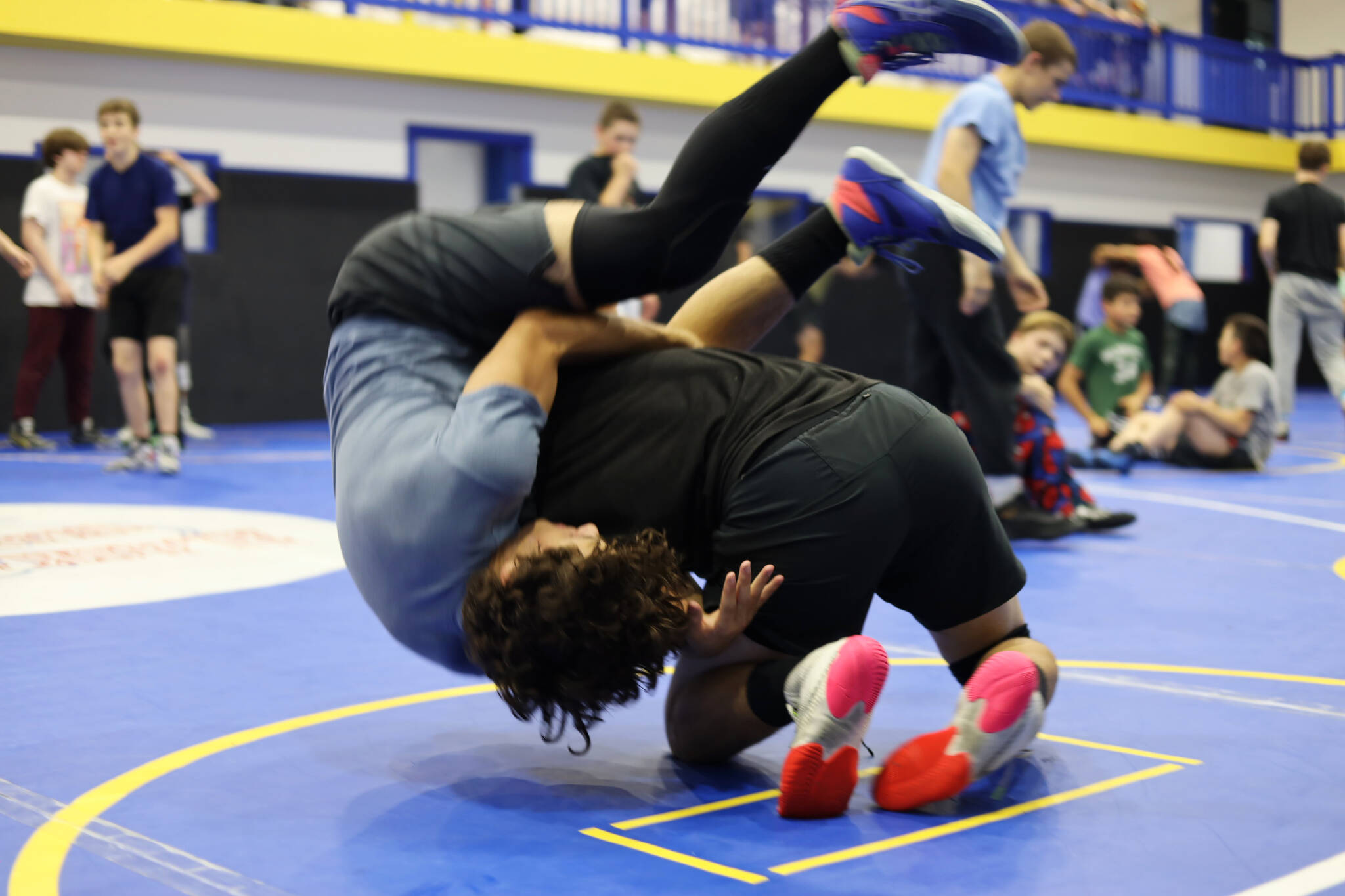 Clarise Larson / Juneau Empire
Hayden Aube and Justus Darbonne practice new moves while wrestling during a Labor Day weekend clinic at the Juneau Youth Wrestling Club’s new building on Monday.
