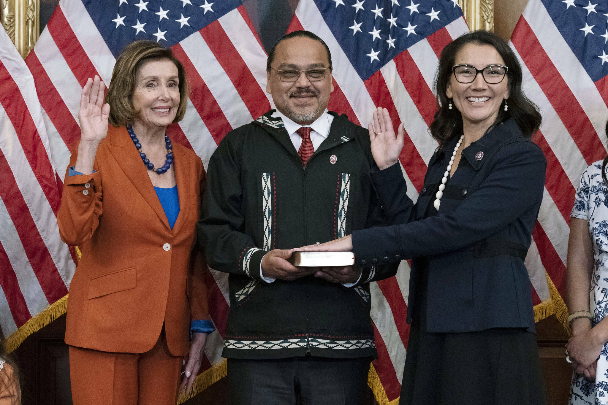 Speaker of the House Nancy Pelosi of Calif., left, administers the House oath of office to Rep. Mary Peltola, D-Alaska, standing next to her husband Eugene “Buzzy” Peltola Jr., center, during a ceremonial swearing-in on Capitol Hill in Washington, Tuesday, Sept. 13, 2022. Peltola’s husband Eugene died in an airplane crash in Western Alaska on Sept. 13, 2023. (AP Photo/Jose Luis Magana, File)