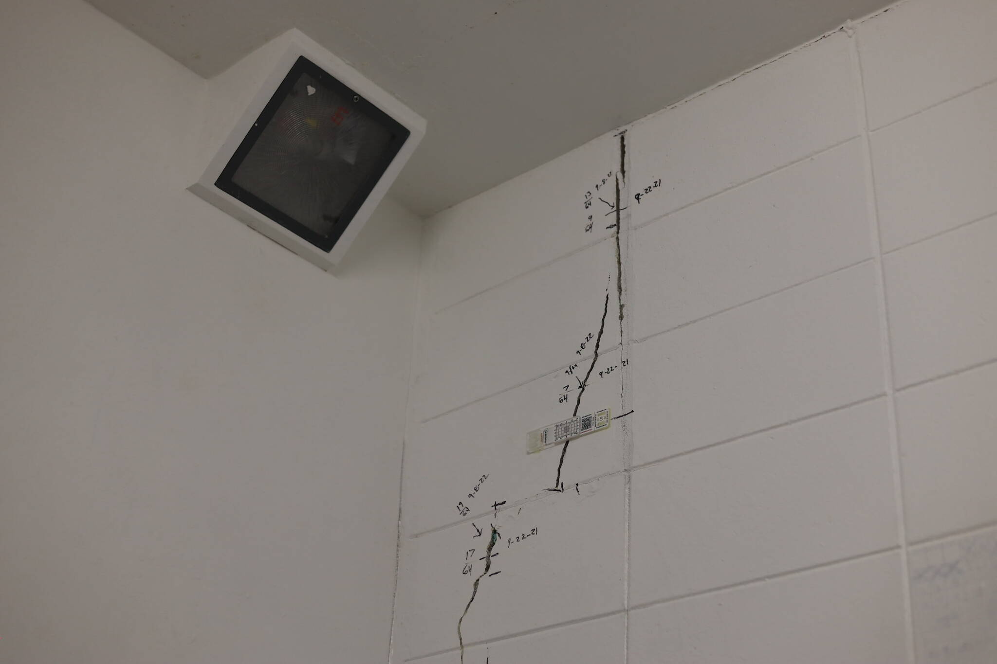 Measuring devices and markings surround cracks in the walls of a cell at Lemon Creek Correctional Center Monday. The prison is currently undergoing structural repairs and renovations following “extreme wet weather” last fall that caused instability at certain locations and prompted emergency repairs. (Clarise Larson / Juneau Empire)
