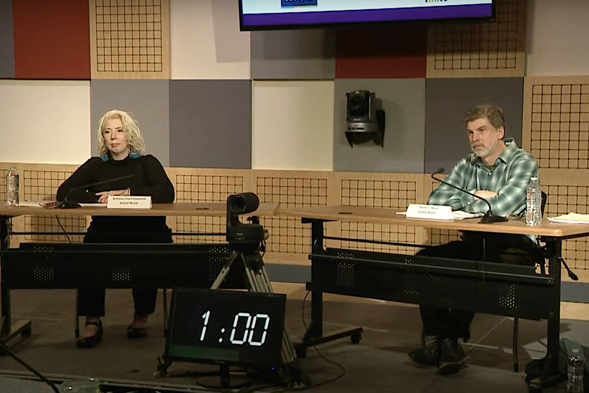 Britteny Cioni-Haywood and David Noon discuss local education issues during the Board of Education candidates portion of a forum Wednesday night at the KTOO studio. (Screenshot from shared video of forum)