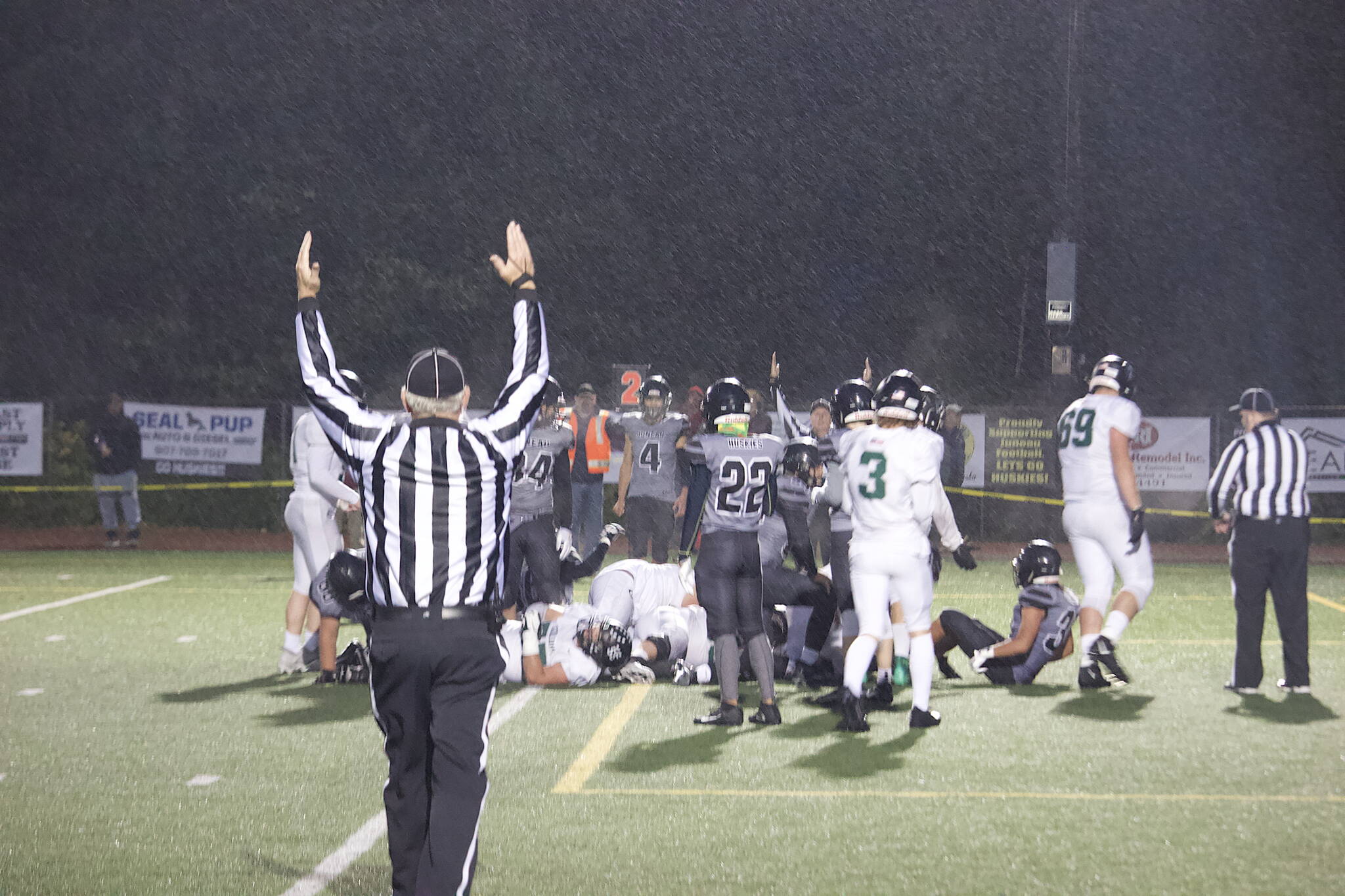 Officials signal a touchdown for Colony High School on a one-yard run in the second quarter, putting team in the lead to stay against the Juneau Huskies on Friday night at Adair-Kennedy Field. It was Colony’s second goal-line run resulting in a score during the quarter. (Mark Sabbatini / Juneau Empire)