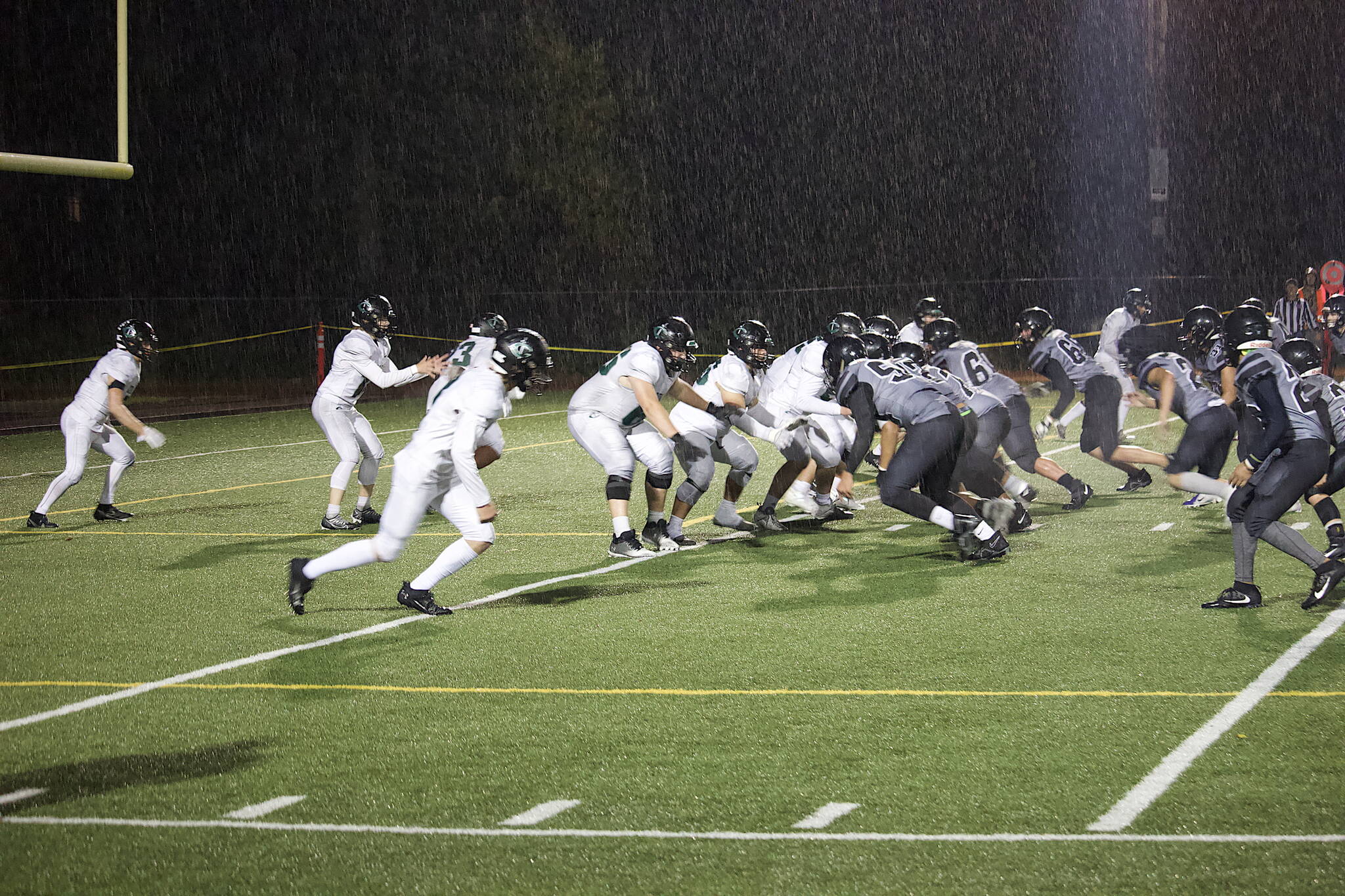 Colony tries to get out of its own end zone after a punt pins them at the 1-yard line during their game against the Juneau Huskies on Friday night at Adair-Kennedy Field. (Mark Sabbatini / Juneau Empire)