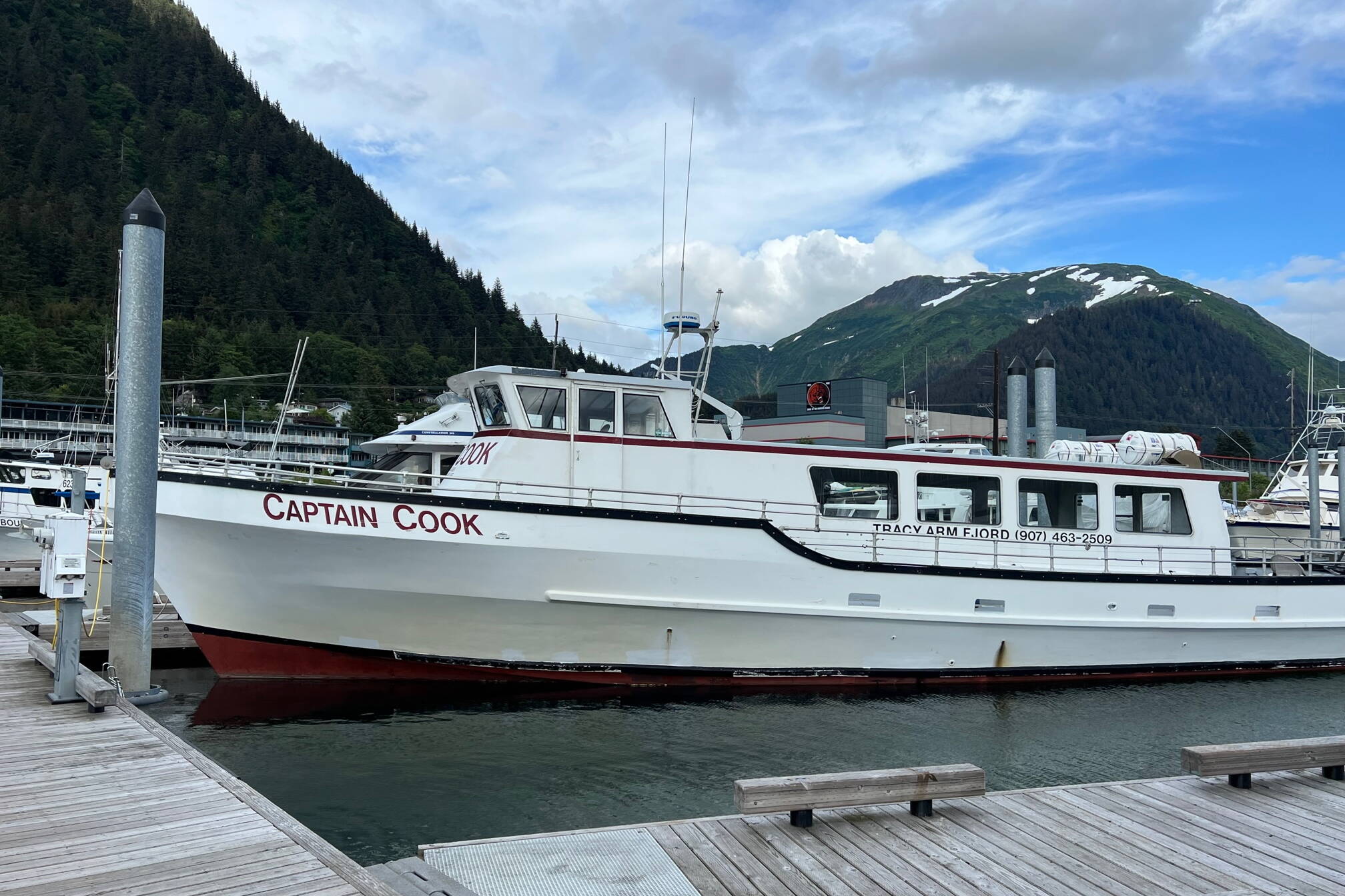 The Captain Cook, one of two tour boats operated by Adventure Bound Alaska, is seen here docked at Aurora Harbor on July 25. The company is facing numerous consumer complaints and legal action involving allegations of canceled trips that were not refunded and unpaid bills. (Meredith Jordan / Juneau Empire)