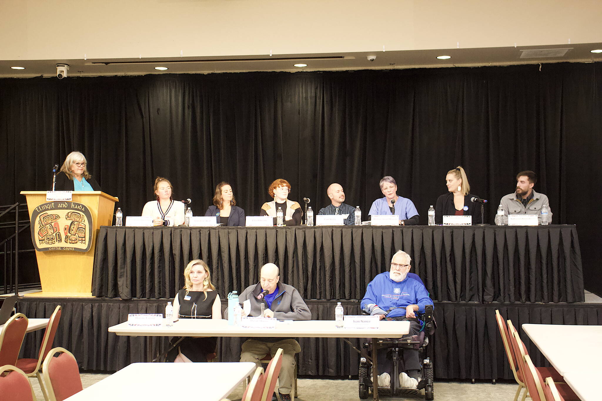 Eleven of the 14 candidates seeking four seats on the Juneau Assembly in the Oct. 3 municipal election answer questions during a forum Friday night at Elizabeth Peratrovich Hall. (Mark Sabbatini / Juneau Empire)