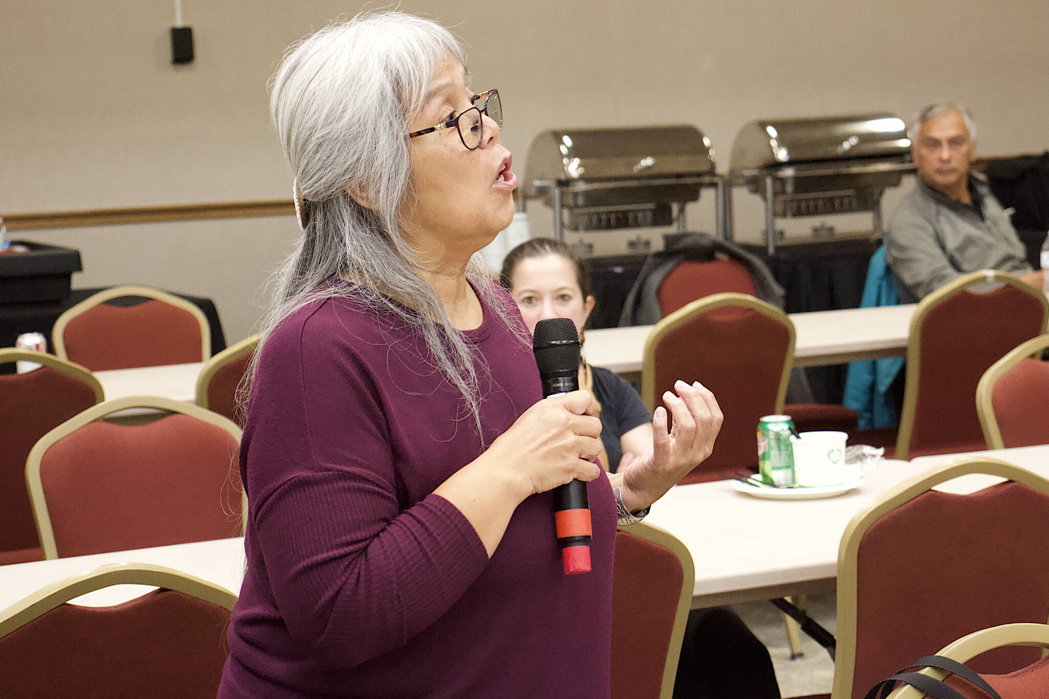 Mary Marks, a tribal citizen with The Central Council of the Tlingit and Haida Indian Tribes of Alaska, challenges Assembly candidates to describe their specific plans of action for working with tribal members if elected during a forum Friday night at Elizabeth Peratrovich Hall. (Mark Sabbatini / Juneau Empire)
