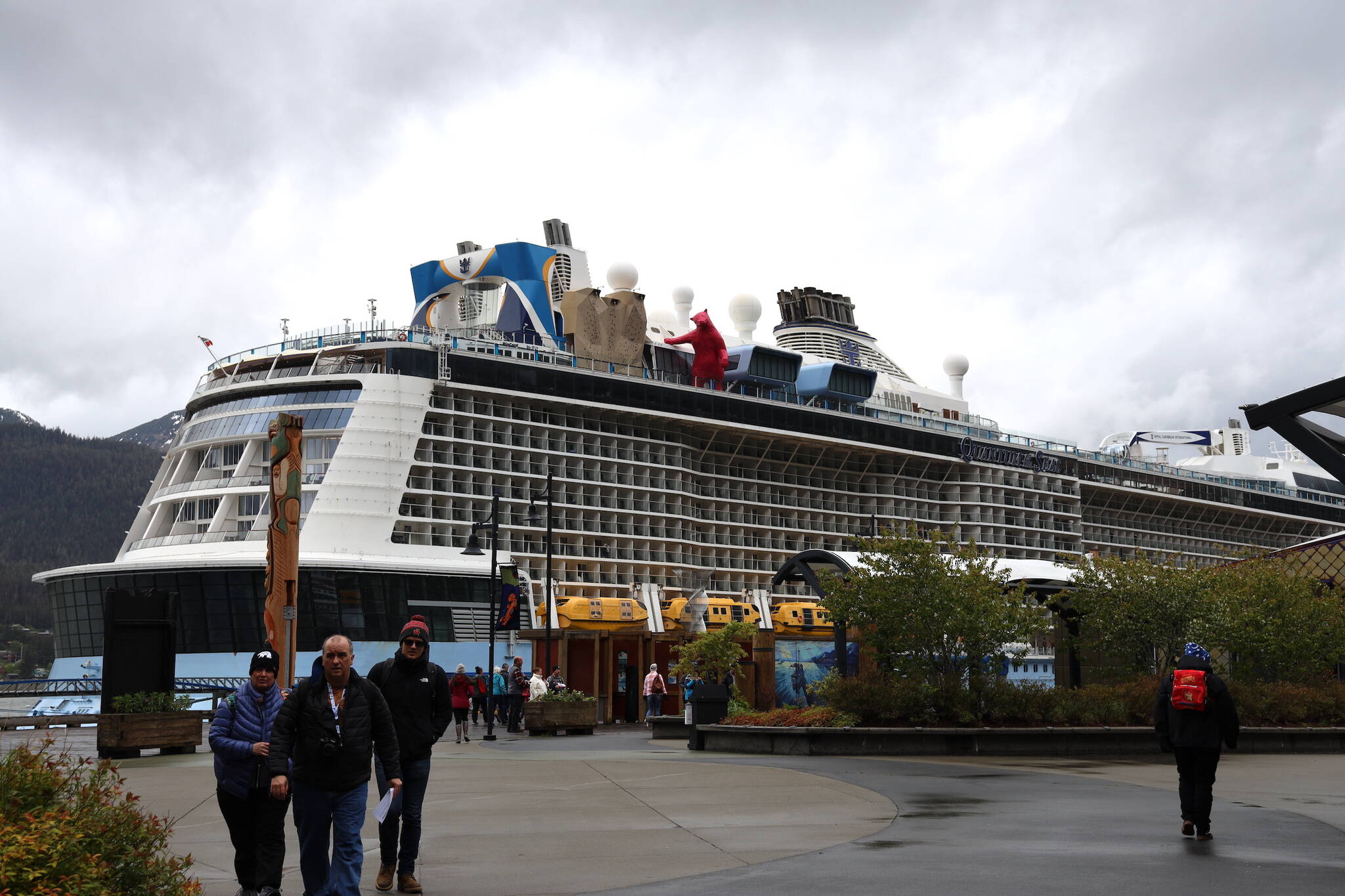 Cruise ship passengers walk around in downtown Juneau in late May. (Clarise Larson / Juneau Empire File)