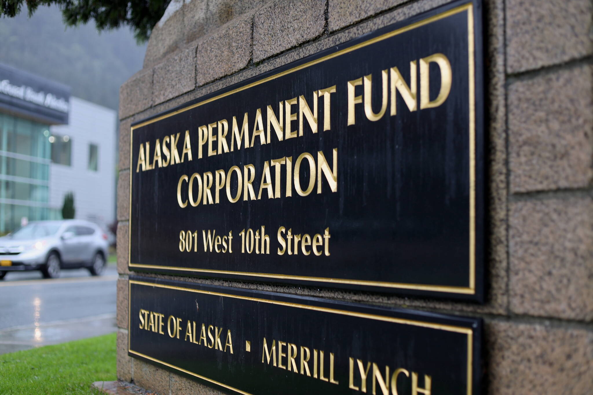 Cars drive past the Alaska Permanent Fund Corp. building in Juneau on Thursday. This year’s Permanent Fund dividend will be $1,312, the state Department of Revenue announced. (Clarise Larson / Juneau Empire)