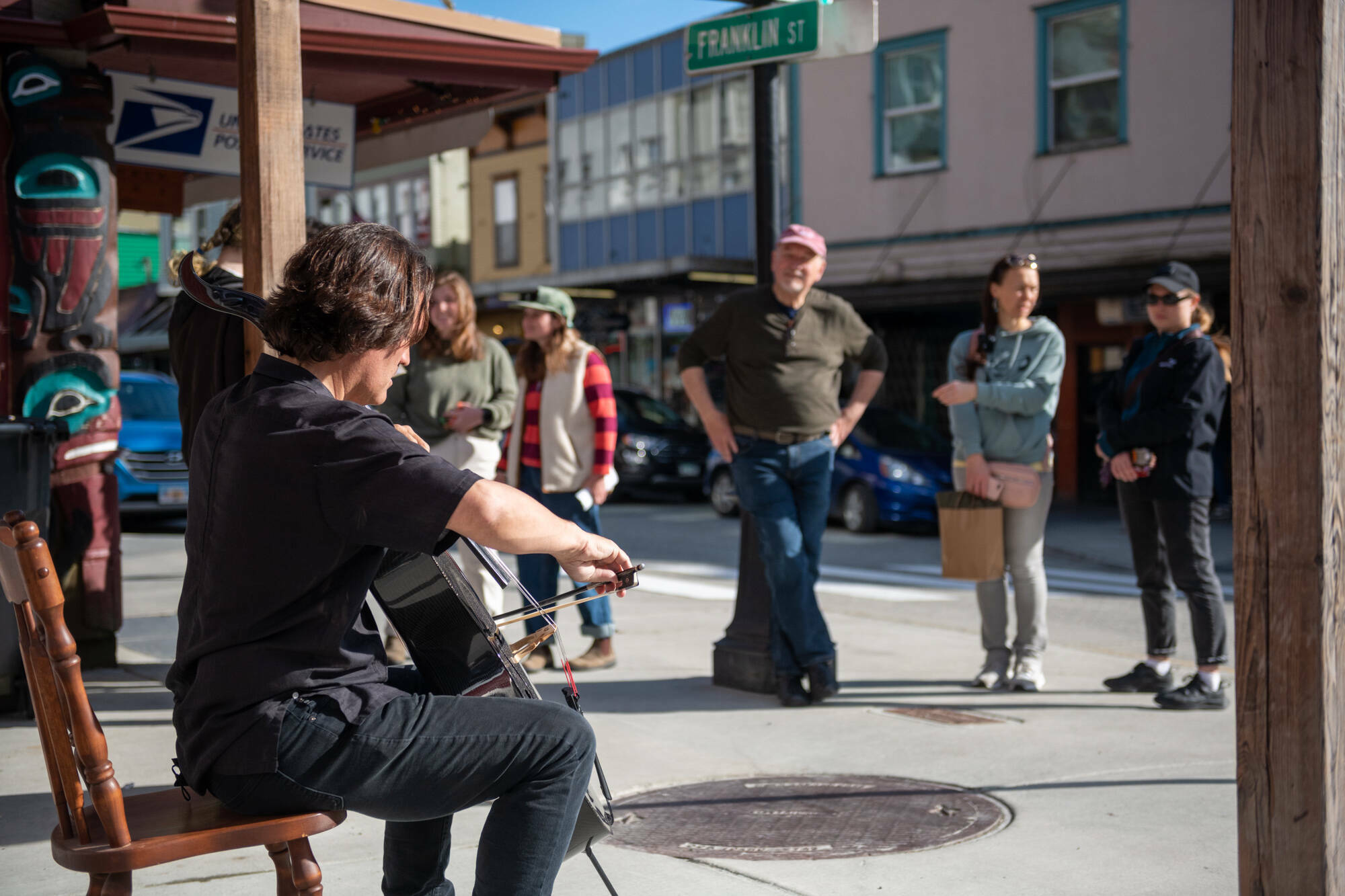 Zuill Bailey, music director of Juneau Jazz and Classics, performs a pop-up cello concert near the food carts at the intersection of Franklin and Front streets during the spring 2022 festival. (Photo courtesy of Juneau Jazz and Classics)