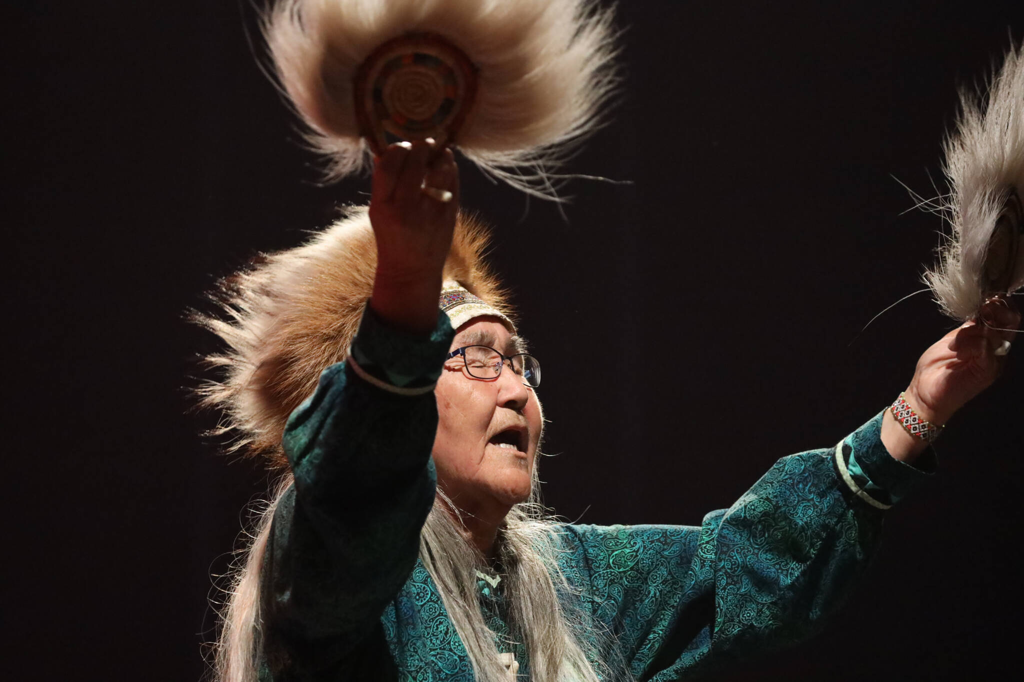 Marie Mead performs a traditional dance during the Inuit-soul musical group PAMYUA!’s performance as part of the final night of the Áak’w Rock music festival at Centennial Hall Saturday evening. (Clarise Larson / Juneau Empire)