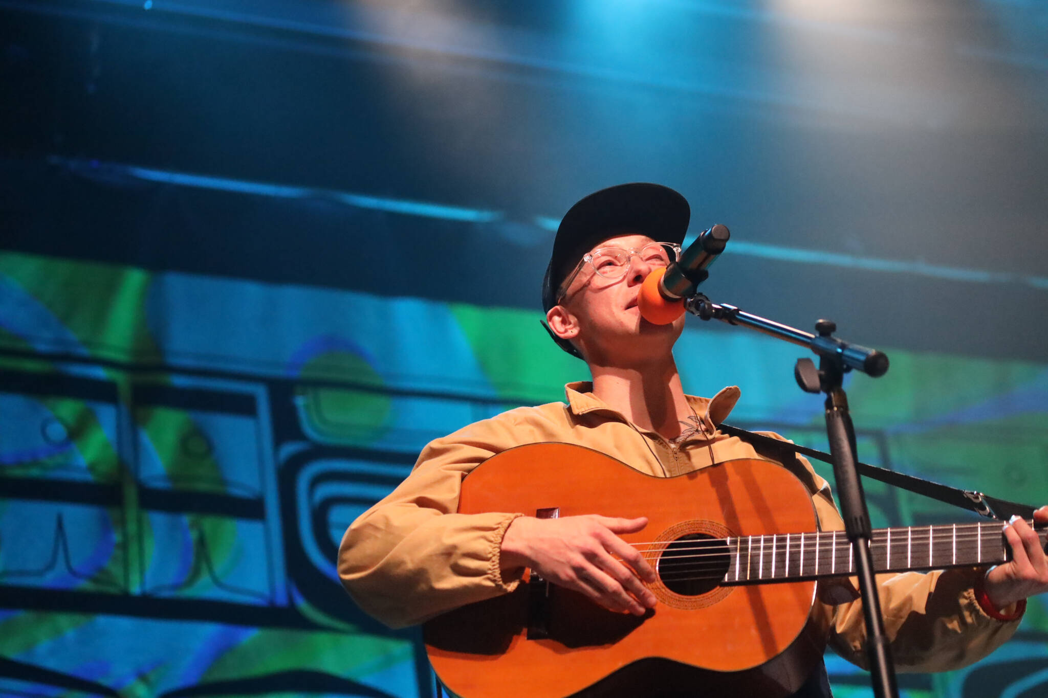 Anchorage musician Quinn Christopherson sings to the crowd during a performance as part of the final night of the Áak’w Rock music festival at Centennial Hall Saturday evening. (Clarise Larson / Juneau Empire)