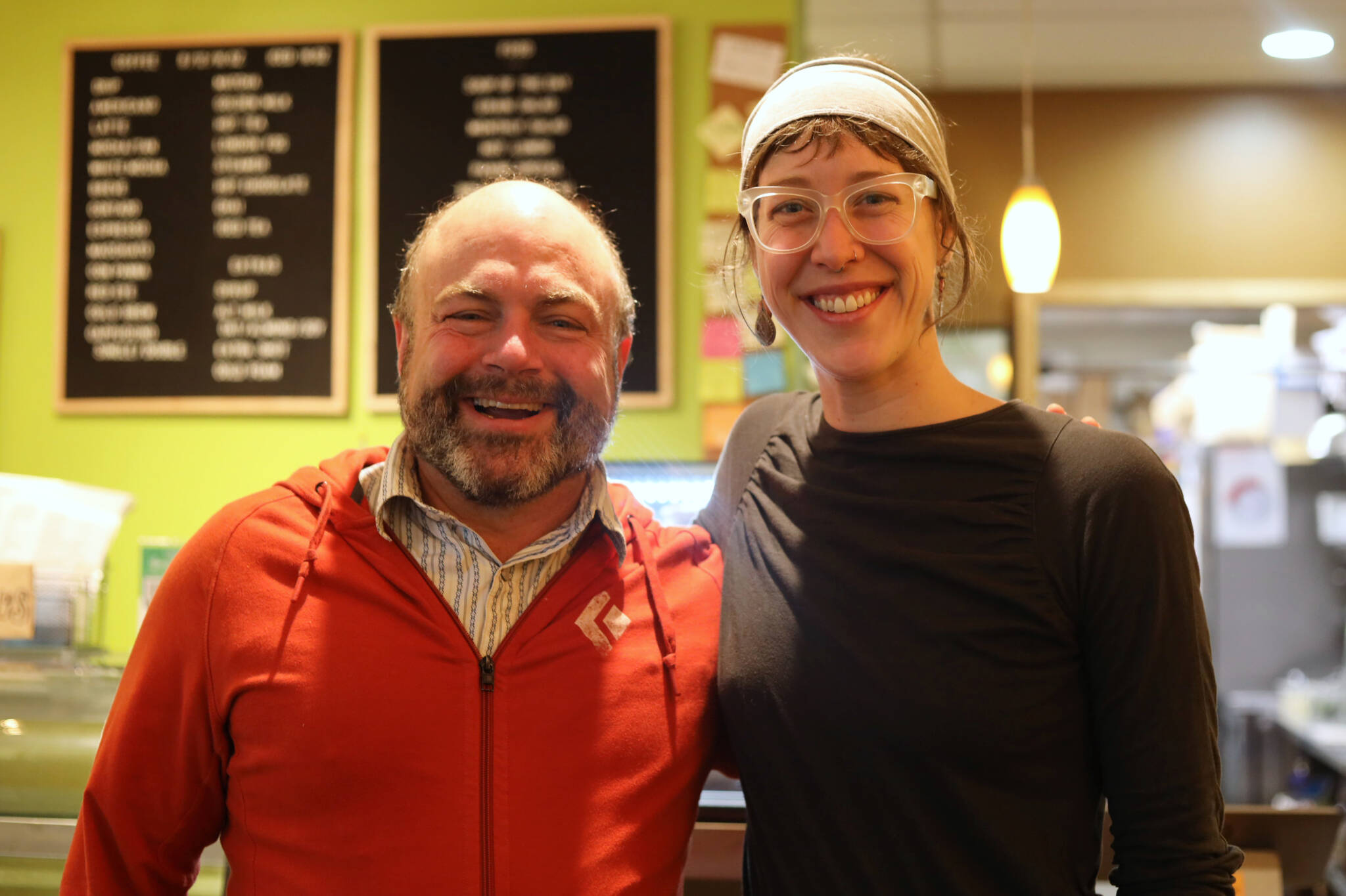 Former Coppa Cafe co-owner Marc Wheeler and current owner Maddie Kombrink smile for a picture at the downtown cafe Wednesday morning. Last week the cafe celebrated its 10-year anniversary in Juneau. (Clarise Larson / Juneau Empire)