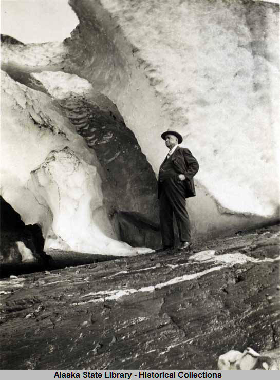 Elmer John “Stroller” White stands beside the Mendenhall Glacier when it was easily accessible in the 1920s. (Alaska State Library, No. P01-3636)