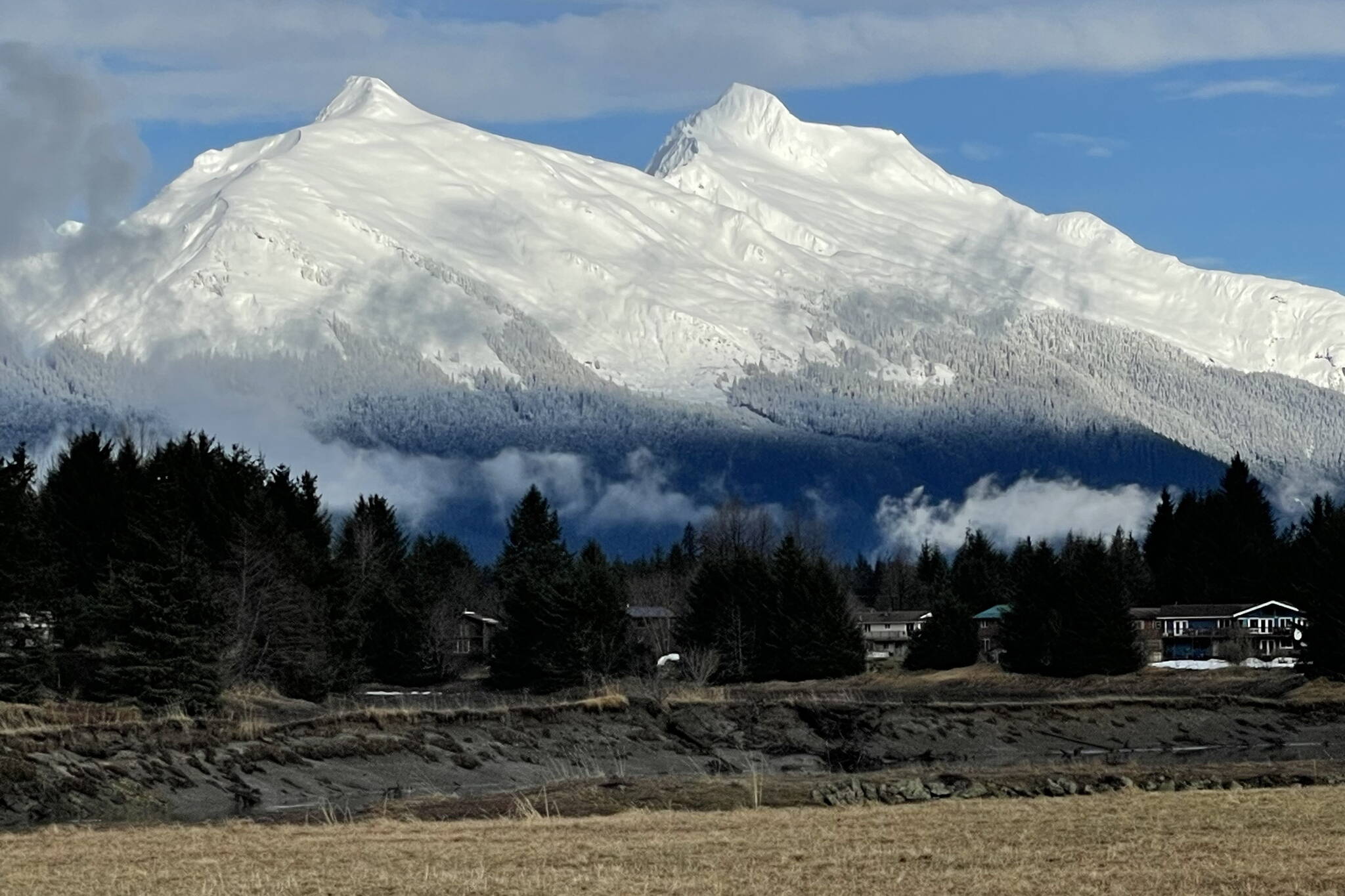 Snow covers Mount Stroller White, a 5,112-foot peak beside Mendenhall Glacier, with Mount McGinnis seen to the left. (Photo by Laurie Craig)