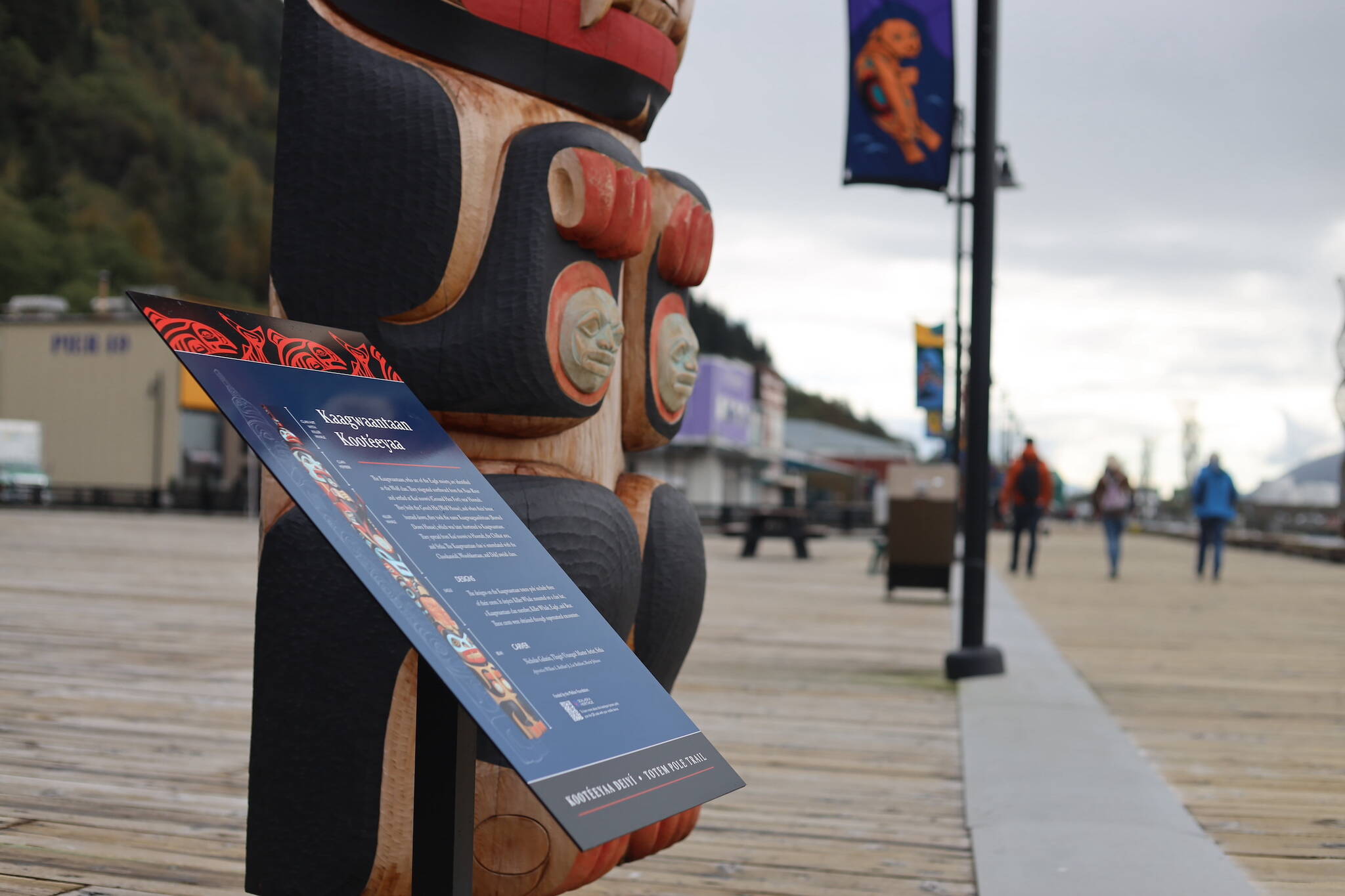 New signs were placed this week to accompany the 12 totem poles raised along Juneau’s downtown waterfront. (Clarise Larson / Juneau Empire)