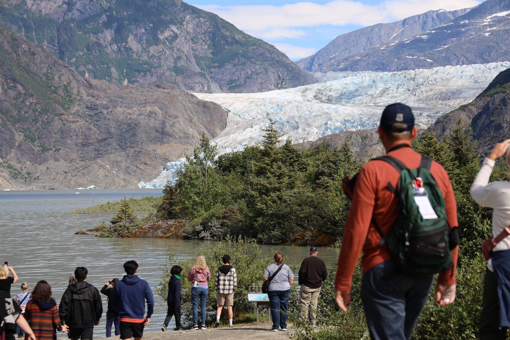 Clarise Larson / Juneau Empire
Visitors look at the Mendenhall Glacier near the Mendenhall Glacier Visitor Center in August.