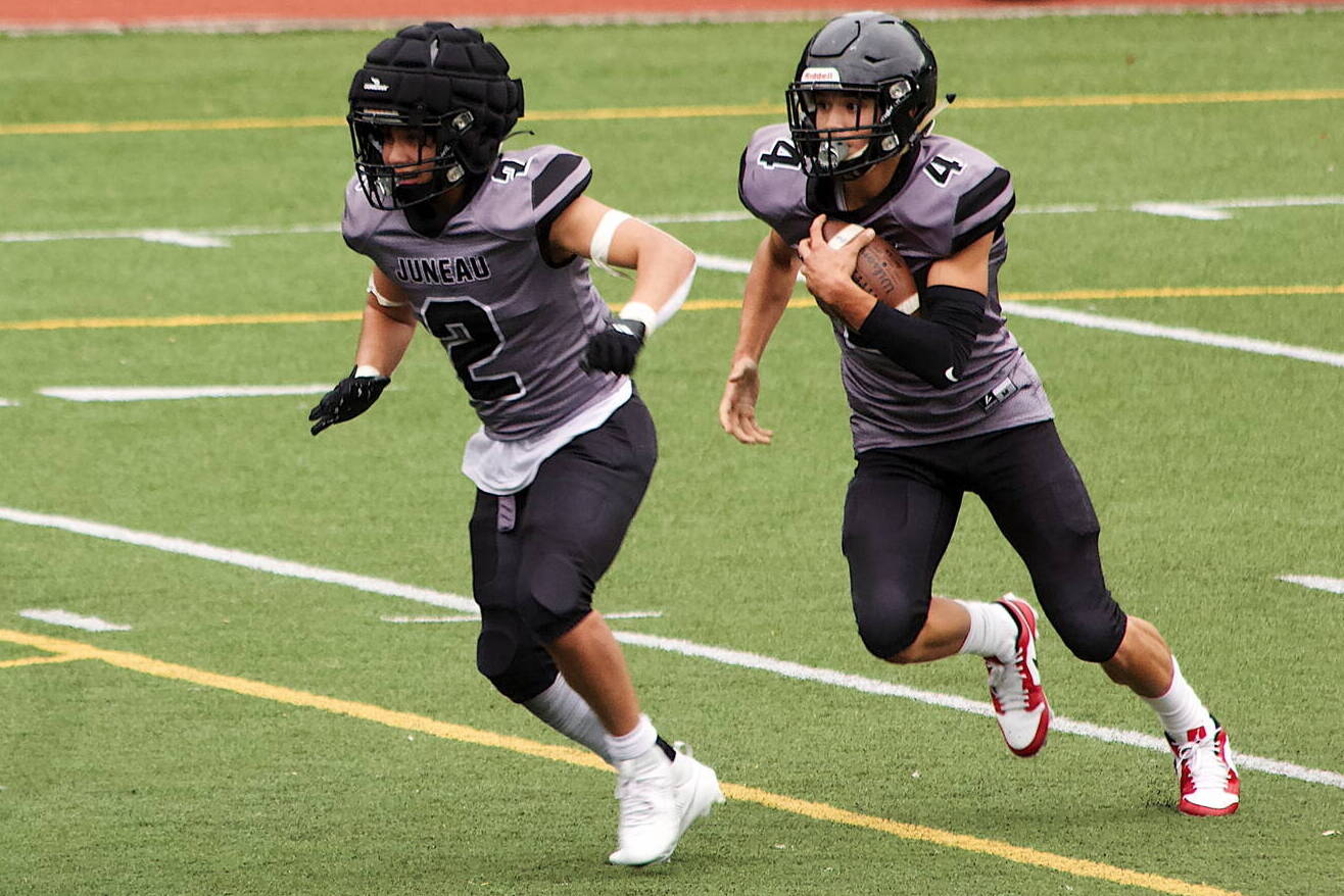 Jayden Johnson (4) and Hayden Aube (2), seen here against Dimond High School on Aug. 19, were the biggest offensive playmakers for the Juneau Huskies this season and were used according during the team’s opening playoff game at Anchorage West High School on Friday night. The Huskies, seeded last in the eight-team conference, took an early lead and battled on even terms with top-ranked Anchorage for most of the first half before losing 48-7. (Mark Sabbatini / Juneau Empire)