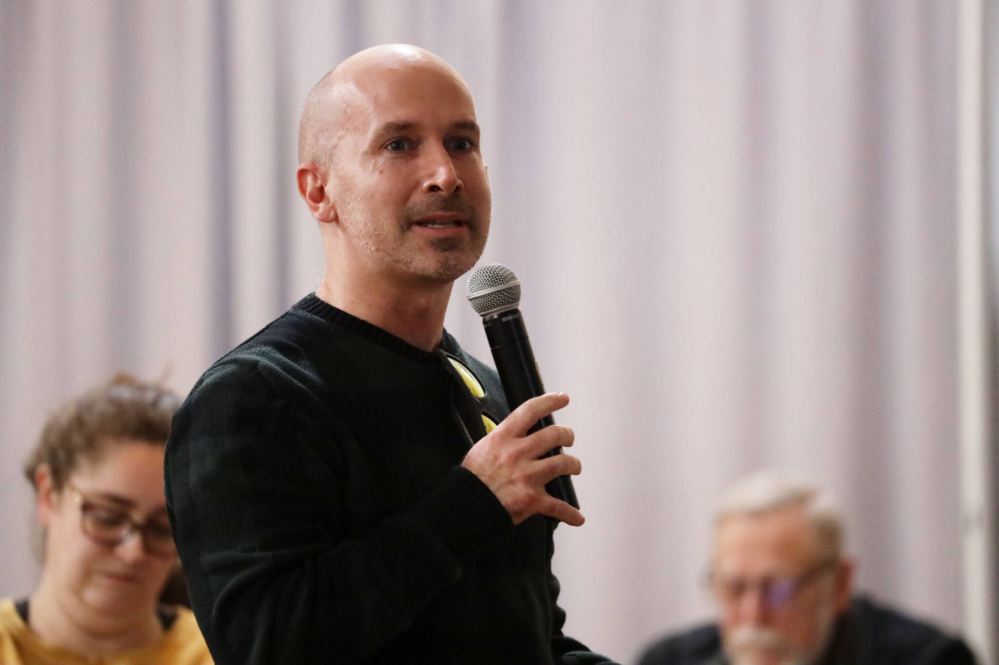 Areawide Assembly candidate Paul Kelly speaks to the crowd gathered at a public meeting to discuss the new design concepts for the Telephone Hill redevelopment project that were presented Wednesday evening at the Juneau Arts and Culture Center. (Clarise Larson / Juneau Empire)