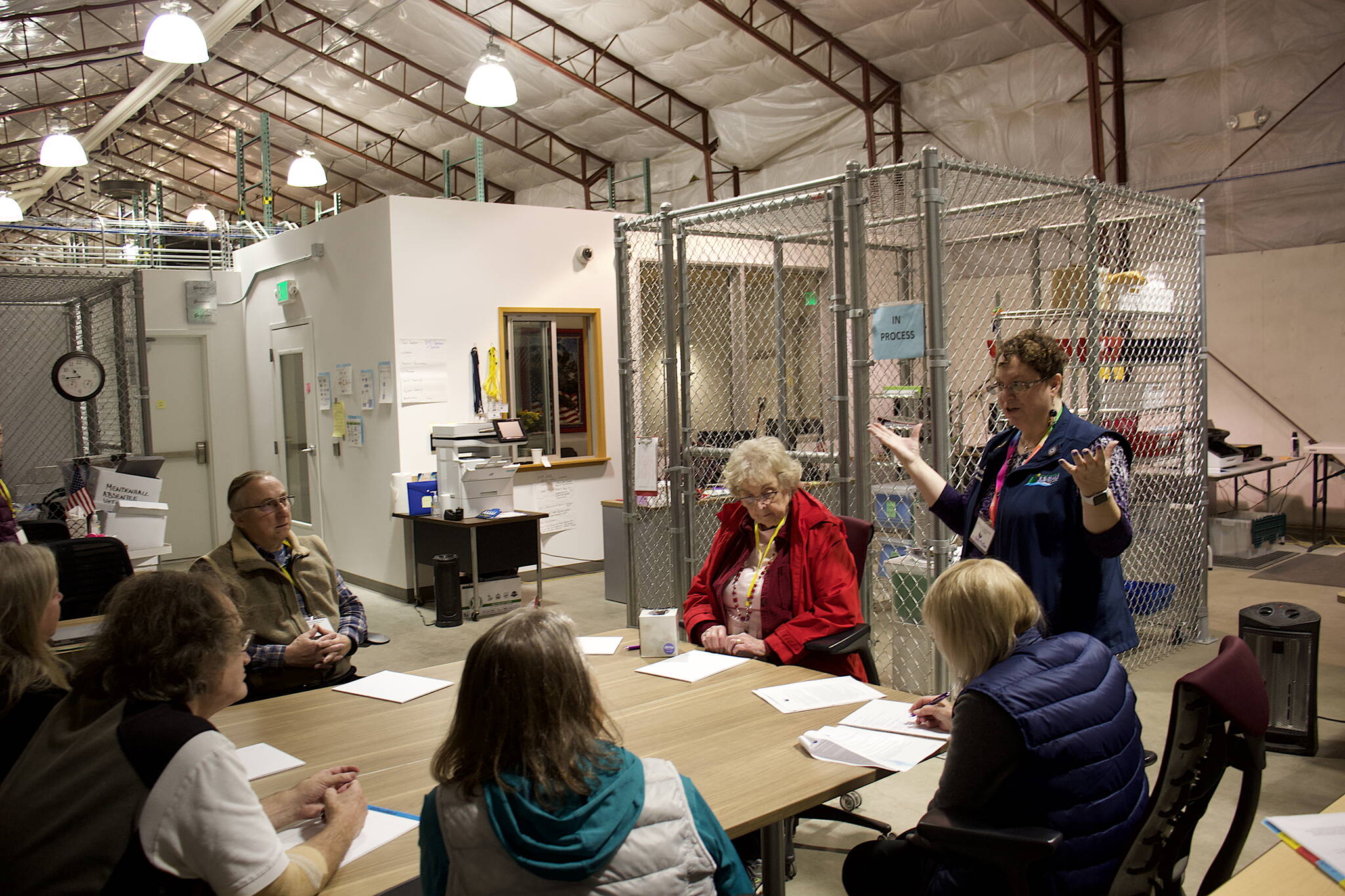 Juneau City Clerk Beth McEwen explains the ballot certification process to election workers Monday at the City and Borough of Juneau’s Ballot Processing Center. The results of the Oct. 3 municipal election were certified Tuesday. (Mark Sabbatini / Juneau Empire)