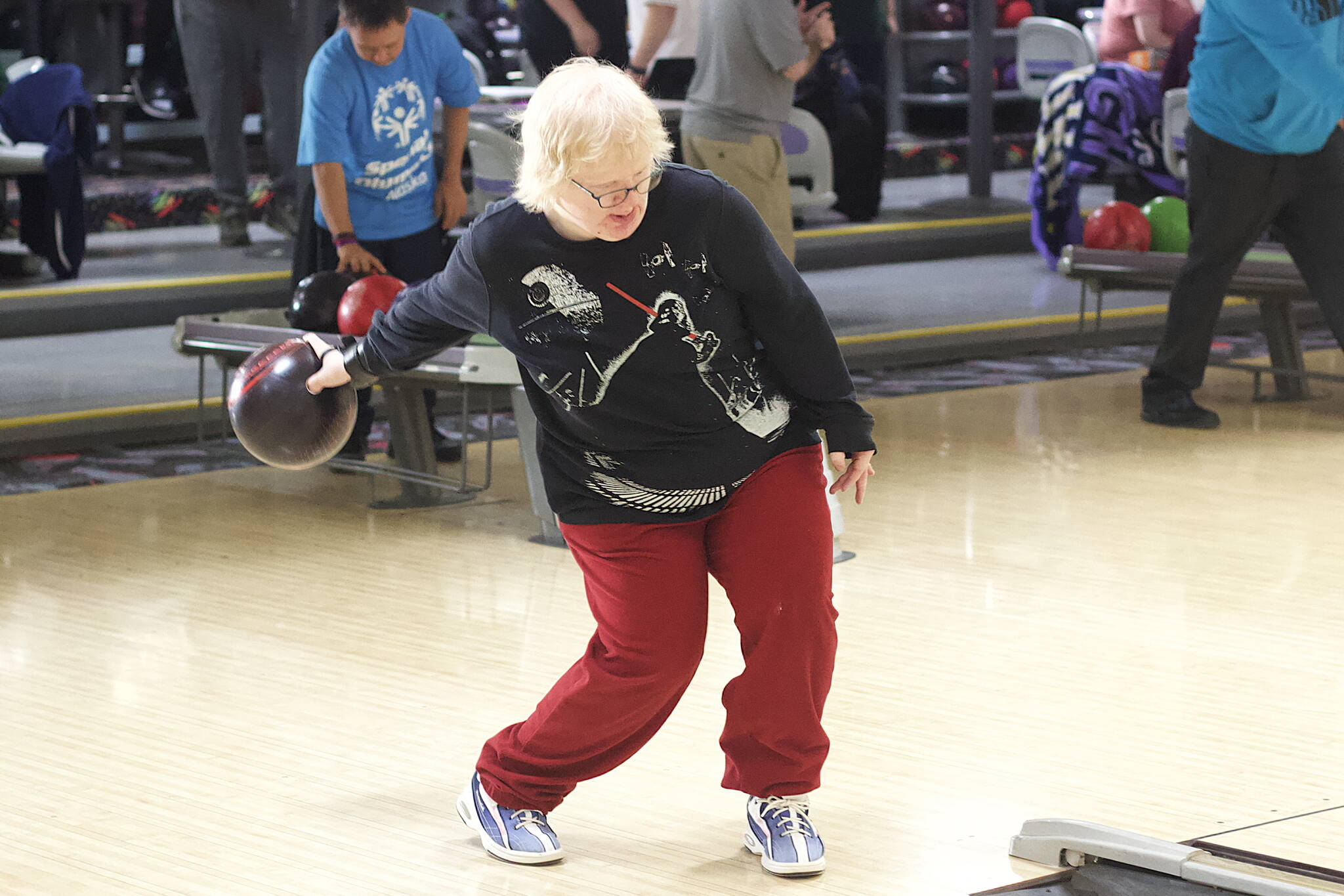Amanda Savikko bowls a frame during the Juneau Special Olympics local games Sunday at Pinz bowling ally, where teams and participants were selected for the upcoming state games in Eagle River. (Mark Sabbatini / Juneau Empire)