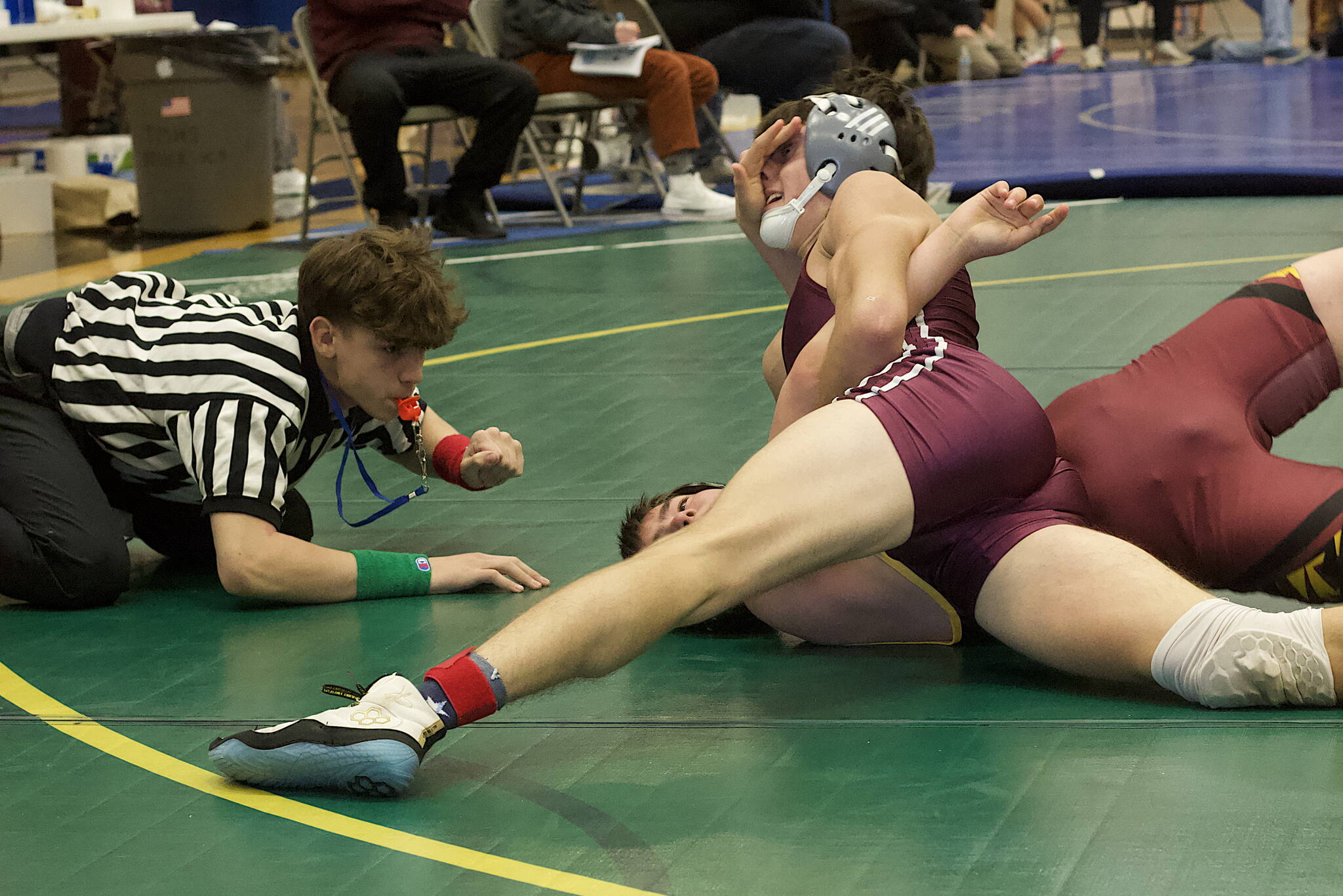 Ketchikan High School’s Hunter Cowan tries to pin Hoonah City School’s Lawrence Howland during the matchup in the 140-pound division of the Southeast Showdown at Thunder Mountain High School on Saturday (Mark Sabbatini / Juneau Empire)