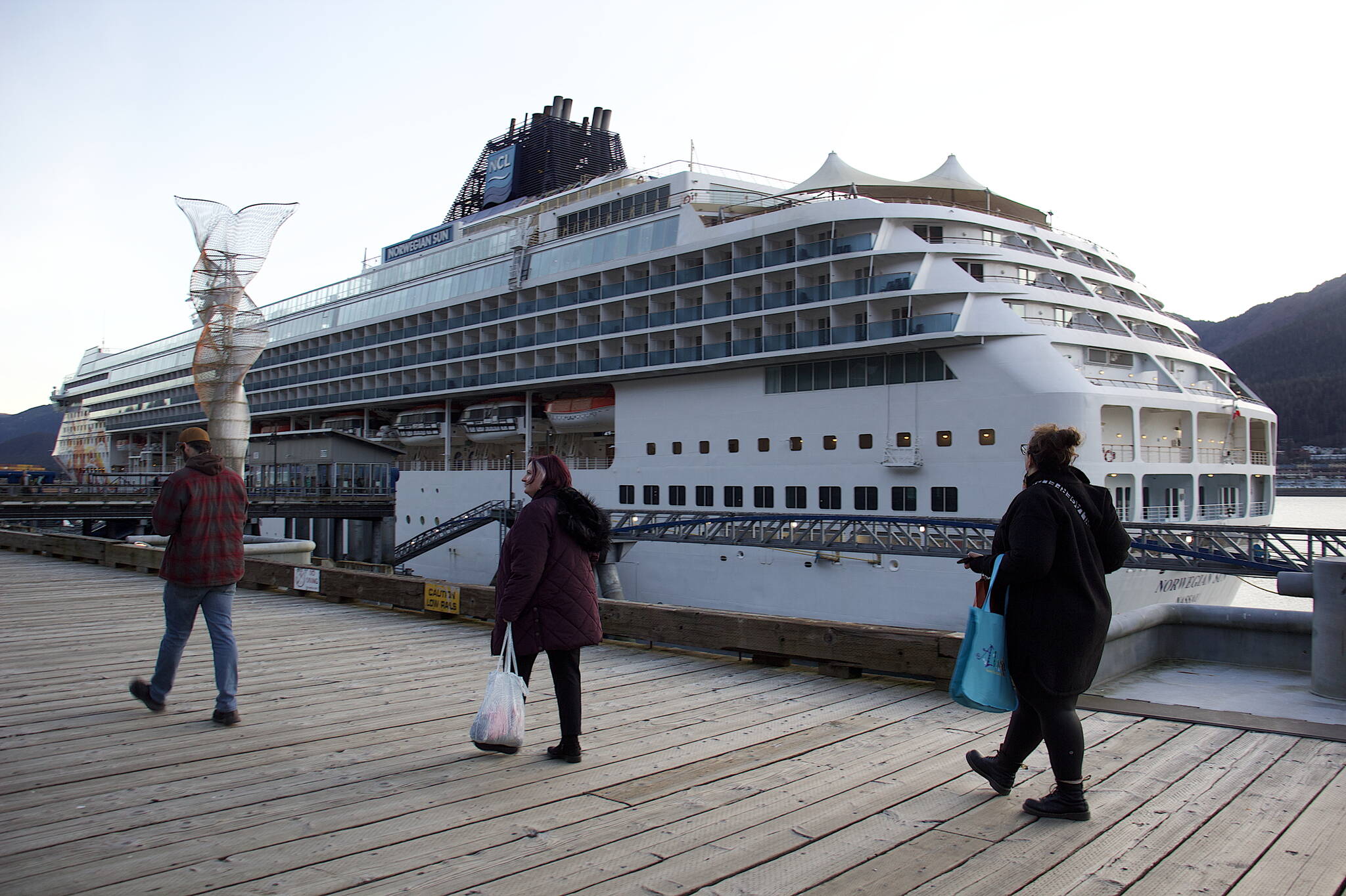 Passengers return to the Norwegian Sun cruise ship early Wednesday evening, the final ship to visit Juneau this year. (Mark Sabbatini / Juneau Empire)