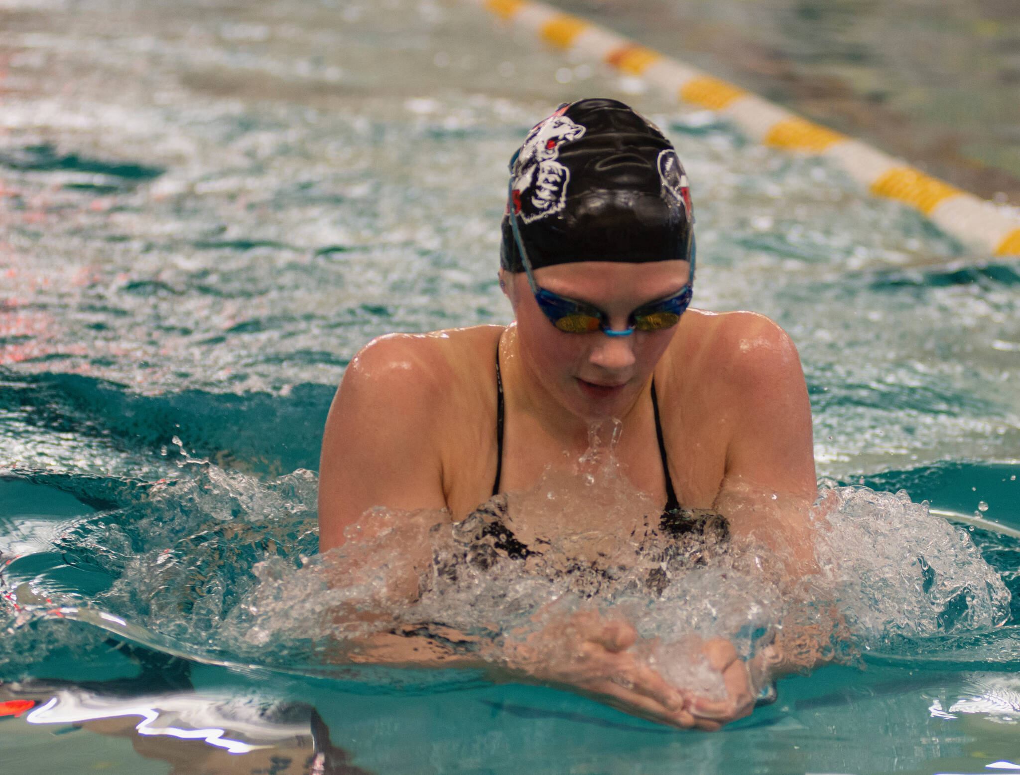 Thunder Mountain High School freshman Lily Francis swims to victory in the 100 breast at last weekend’s Region V Championships in Sitka. (James Poulson/Daily Sitka Sentinel)