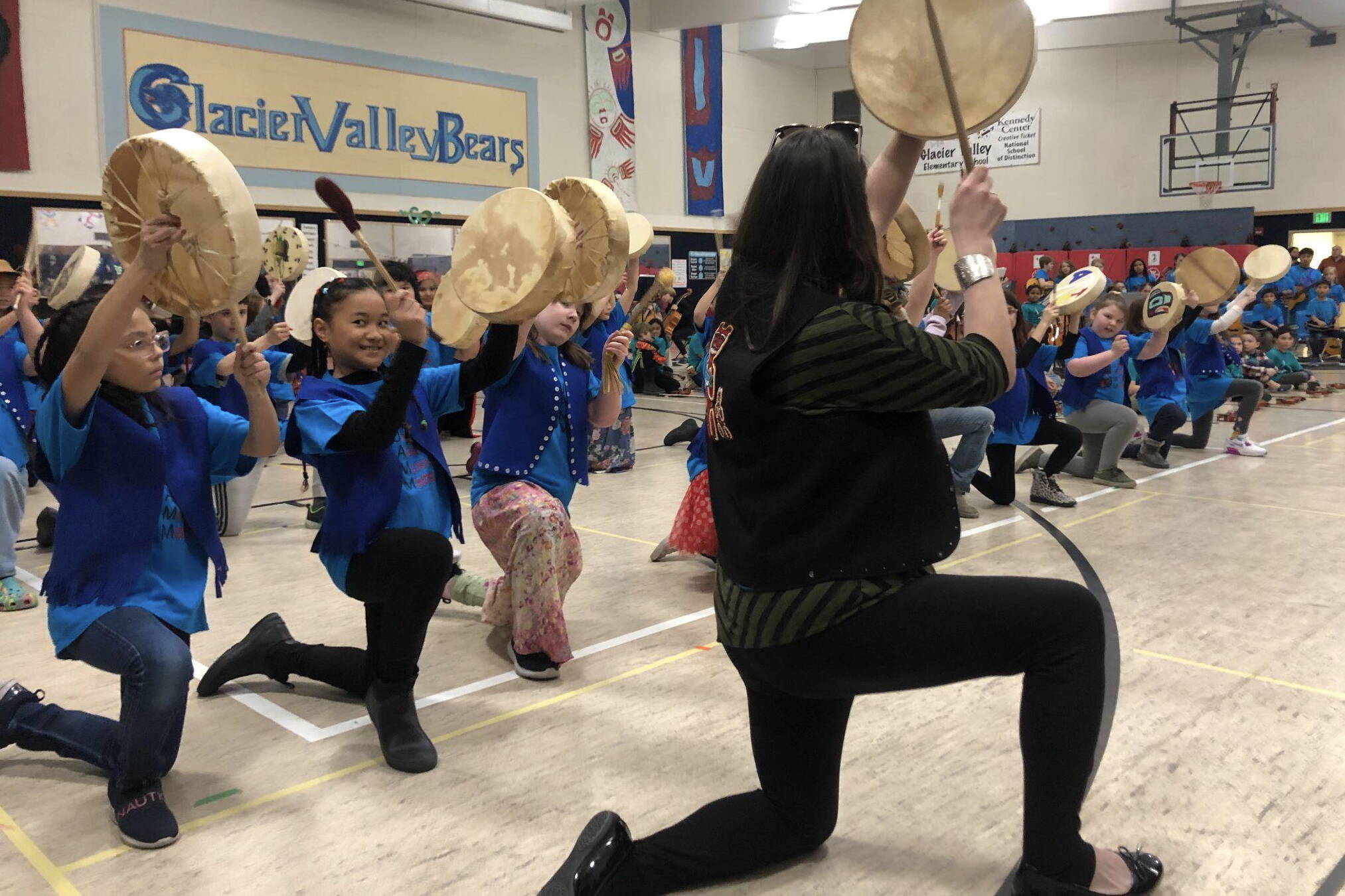 Participants in the Juneau Alaska Music Matters program perform on Alaska Native drums at Sitʼ Eeti Shaanáx̱ Glacier Valley Elementary School. (Photo courtesy of Juneau Alaska Music Matters)
