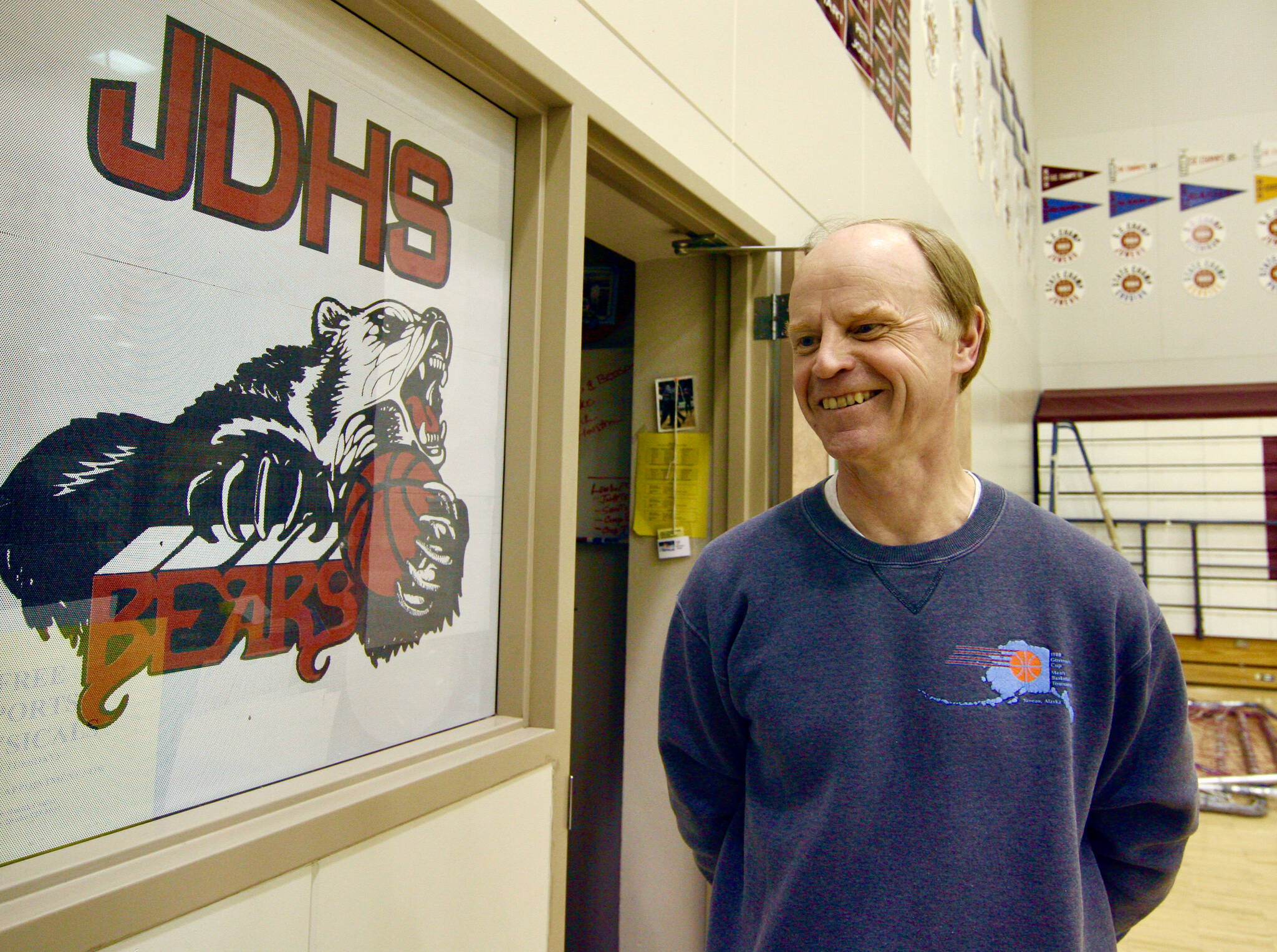 This photo from 2006 shows Juneau-Douglas High School long-time boys basketball coach George Houston after announcing his retirement from 32 years with the Crimson Bears basketball program, the last 13 as head coach. (Juneau Empire file)