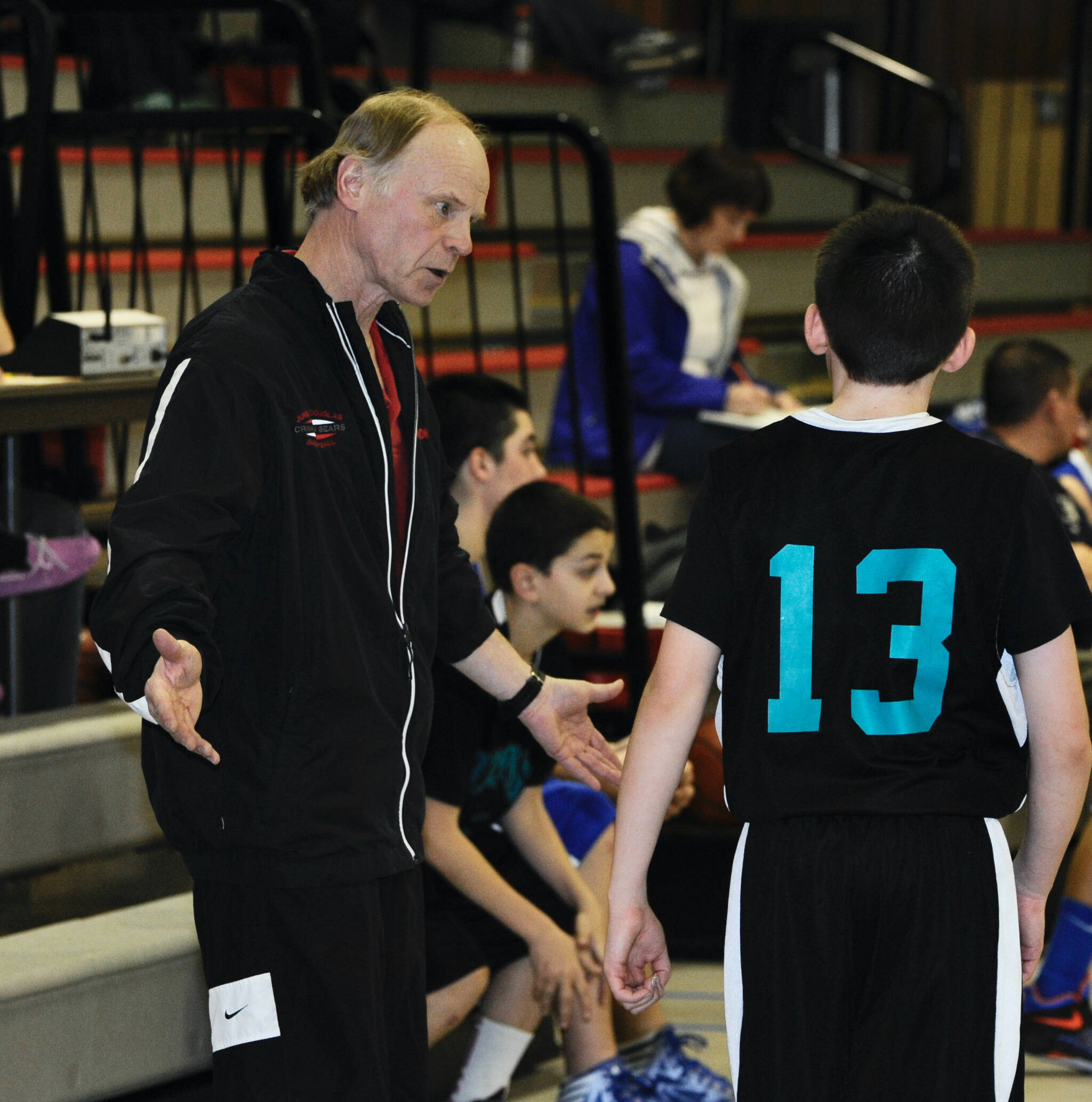 Dzantik’i Henni Middle School coach George Houston talks to a DZ player during the 2012 Icebreaker Tournament. (Klas Stolpe for the Juneau Empire)